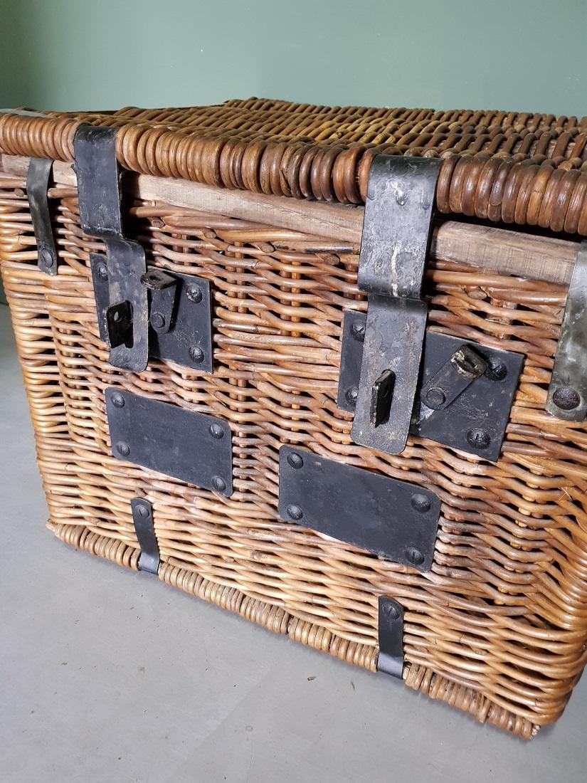 Old French basket with heavy metal hinges and locks, it is unclear what it was intended for and is further in a good condition with light user marks. From around 1900.

The measurements are,
Depth 46 cm/ 18.1 inch.
Width 59 cm/ 23.2