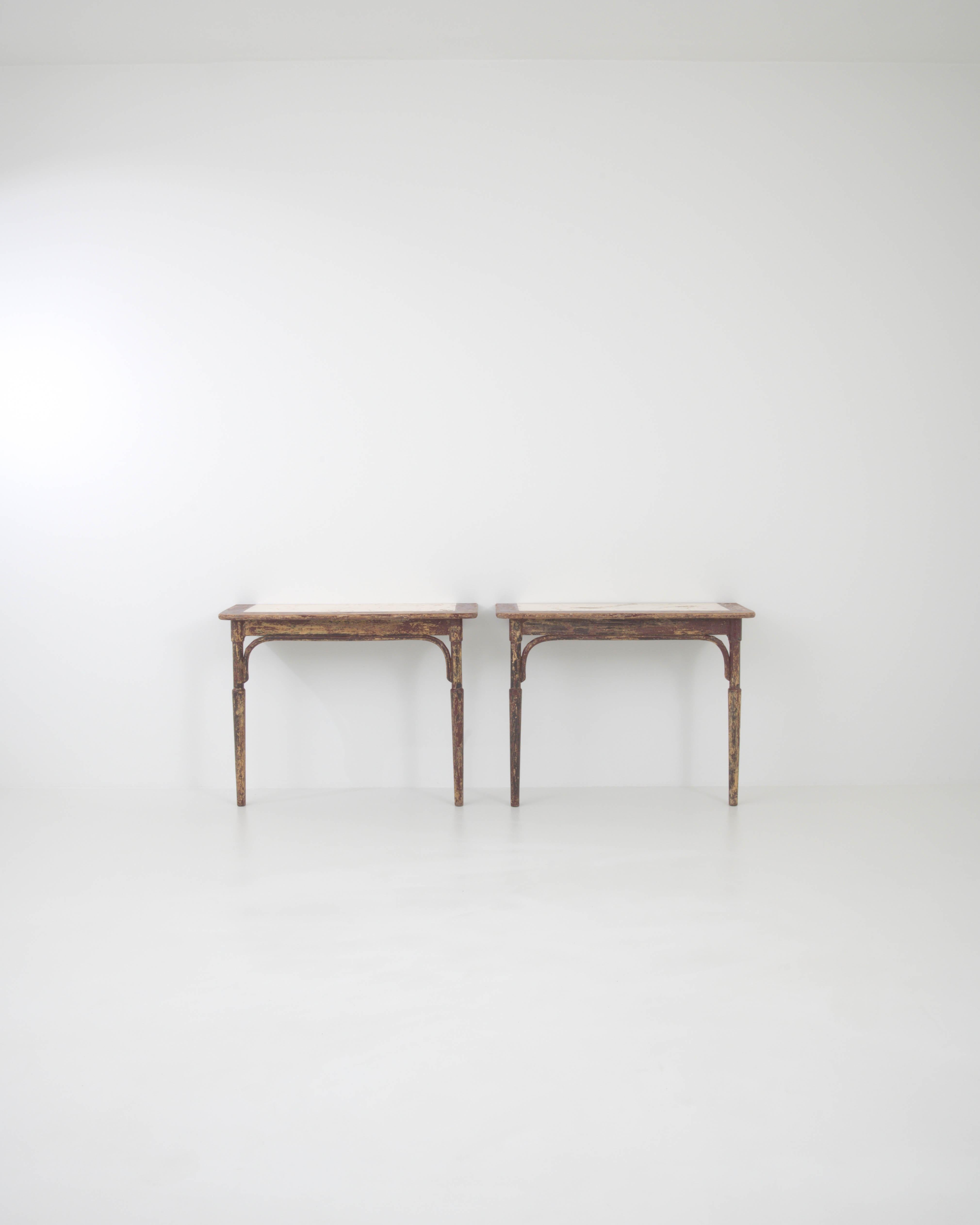 Step into a realm where vintage charm meets artisanal craftsmanship with this stunning pair of Early 20th Century French Wood Patinated Console Tables by Thonet. Each table stands as a testament to the enduring allure of classic design, with