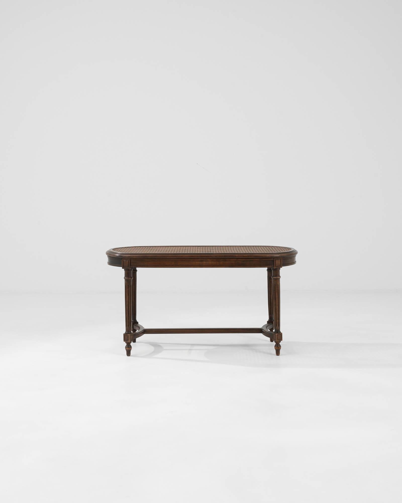 Introducing our exquisite Early 20th Century French Wooden Bench, reminiscent of the opulent Louis XVI style benches crafted in the early twentieth century. Made with precision and finesse in France, this bench epitomizes the elegance and grace of