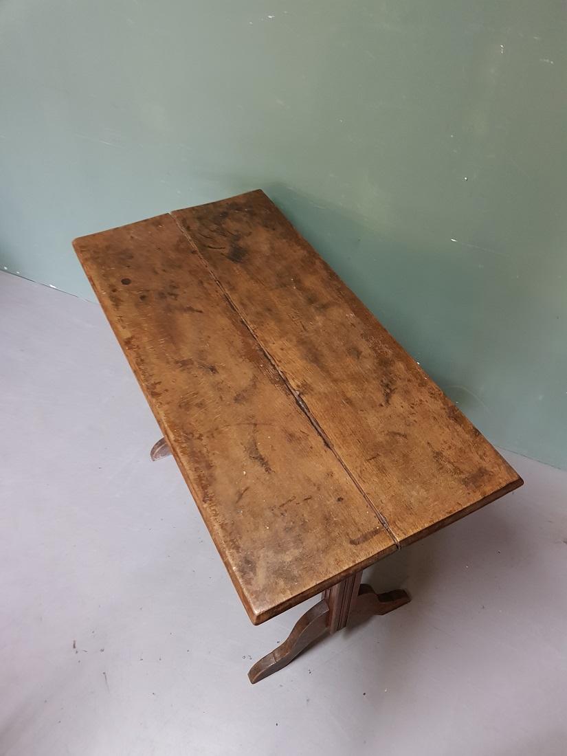 Old French wooden bistro table with a weathered appearance but in reasonable and sturdy condition. Originating from the 1st half of the 20th century.

The measurements are,
Depth 49 cm/ 19.2 inch.
Width 99 cm/ 38.9 inch.
Height 74.5 cm/ 29.3