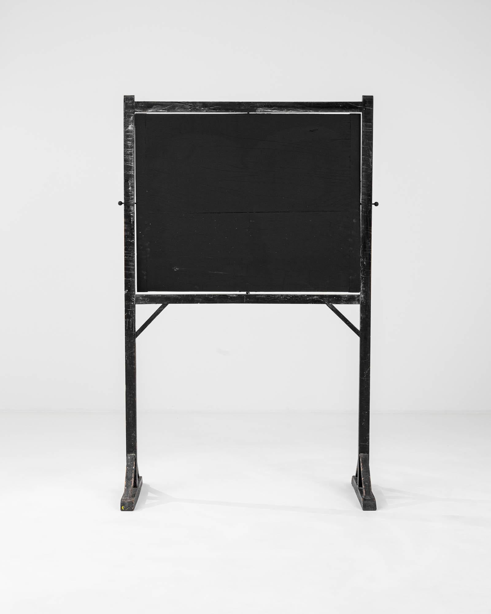 Introducing a piece of history reimagined for the modern era: our Early 20th Century French Wooden Blackboard. Embodying the essence of vintage charm, this meticulously crafted blackboard transports you to a bygone era of French elegance. Crafted