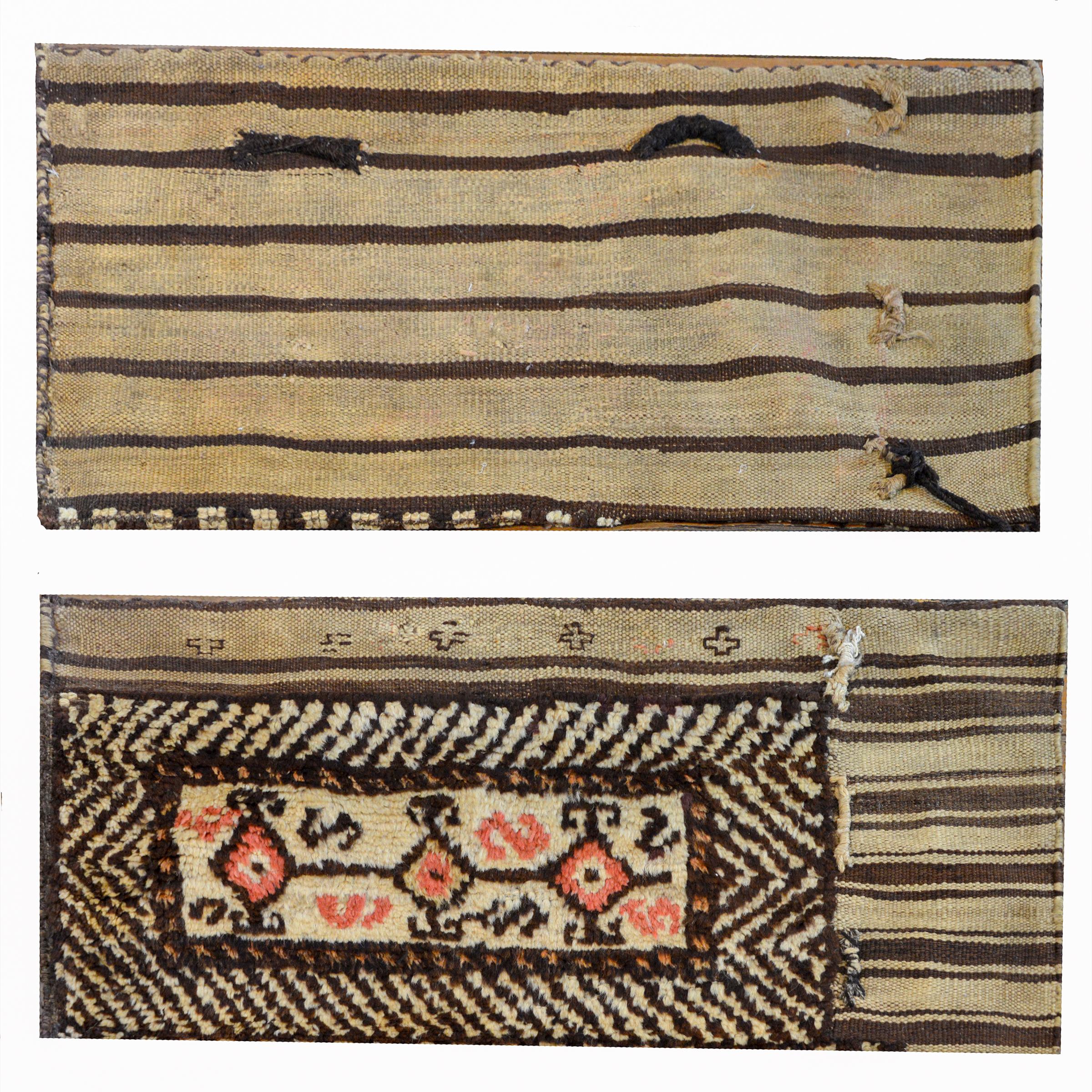 A fantastic pair of early 20th century Persian Gabbeh grain bags, each with three brown diamond medallions in the center of a cream field with a wide diagonal brown striped border.