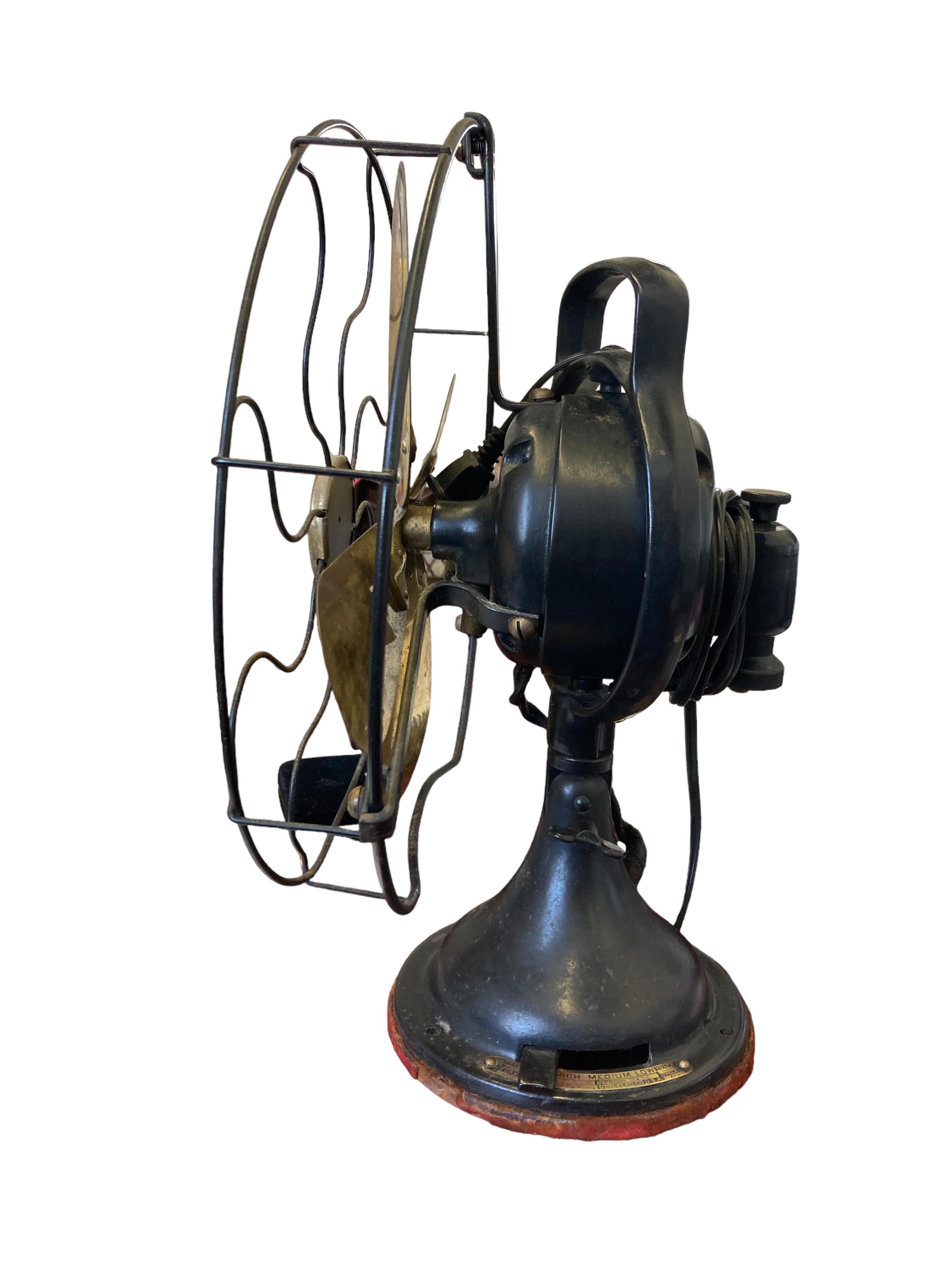 This early 20th century General Electric brass blade table fan was fully restored to peak functionality. The front of the fan measures 13” across and each of the four blades measures 5 1/2” in length. Height is 16”. The original, red felt base is in