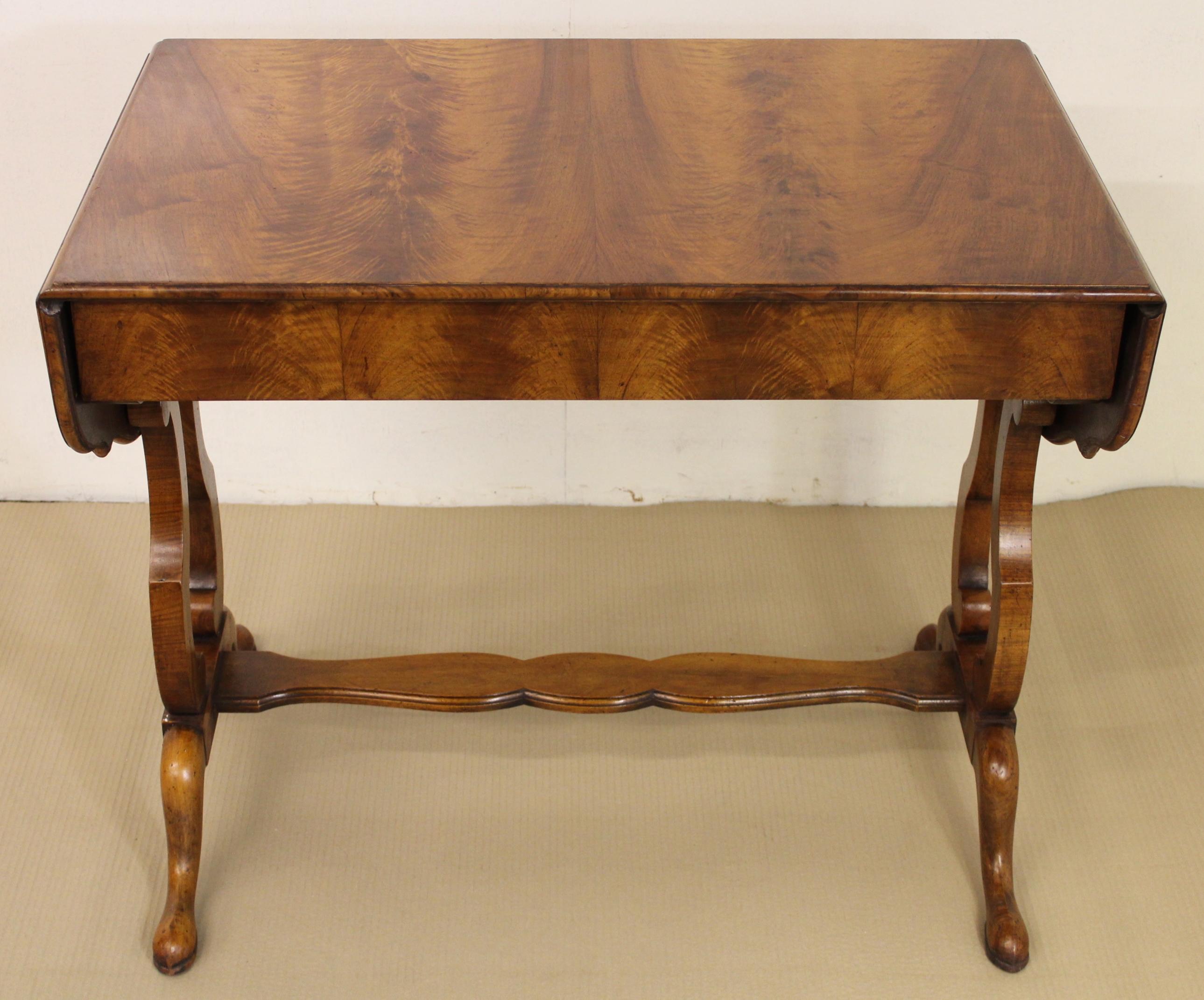 A very good Georgian style burr walnut sofa table. Of good construction in solid walnut with burr walnut veneers. We have had this table sympathetically repolished to a very high standard, it has a wonderful warm color and patina. The single, long,