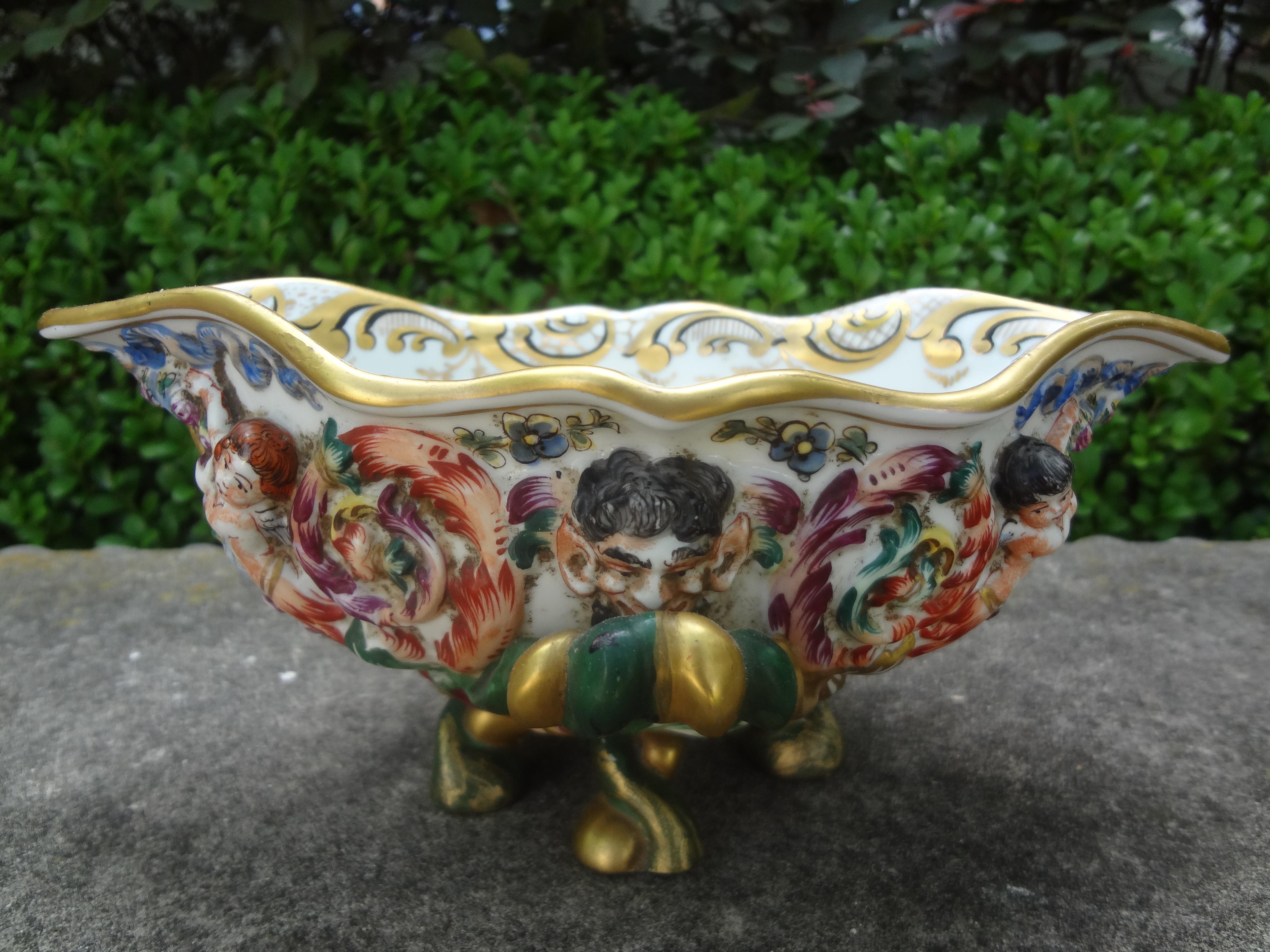 German Capodimonte style porcelain bowl.
Charming early 20th century German hand decorated capodimonte style porcelain bowl, vide poche or serving dish. Beautifully decorated inside and outside.