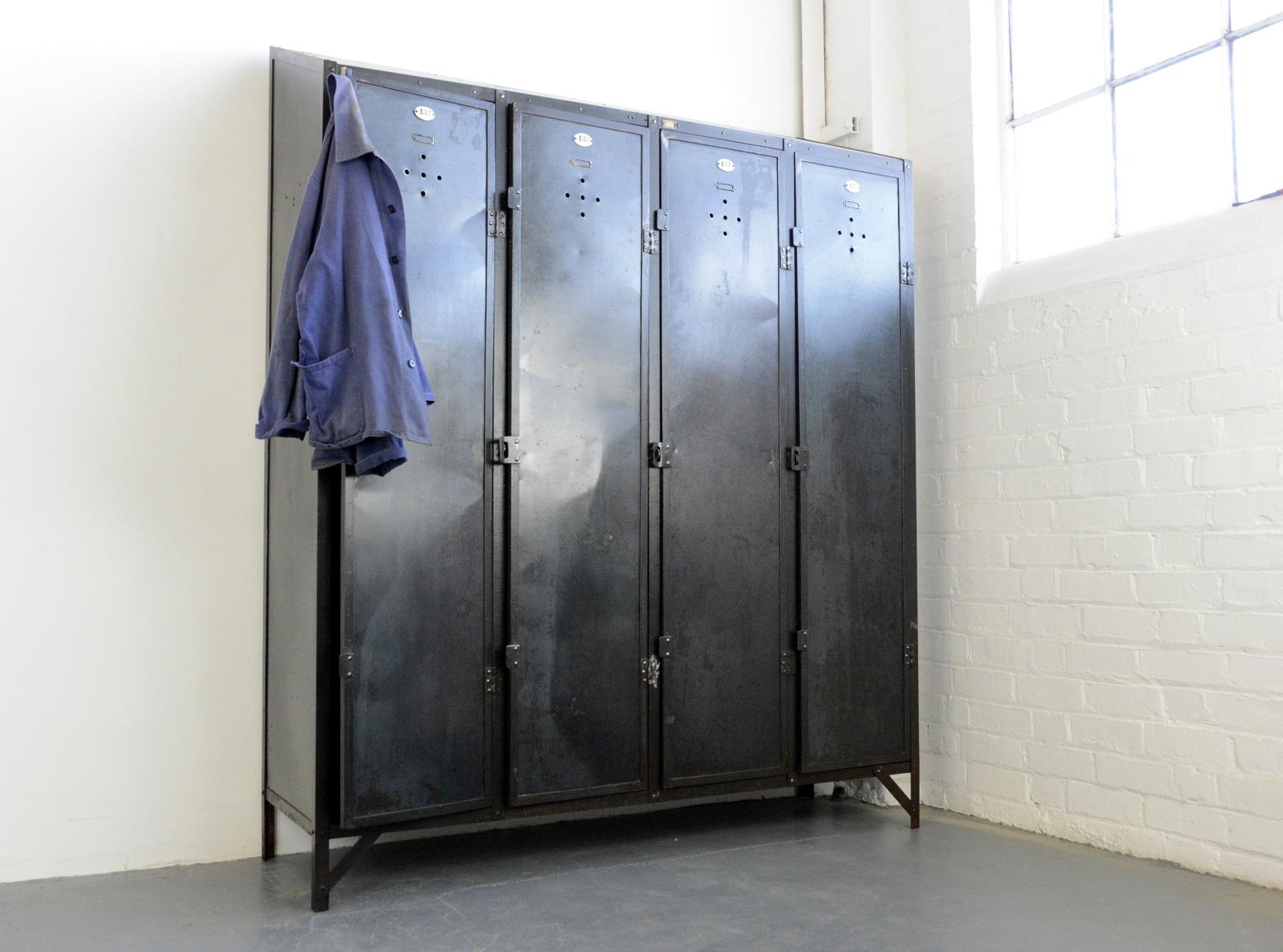 Early 20th century German industrial lockers, circa 1910

- Steel construction with vented doors
- Porcelain door numbers
- Each compartment has 2 hooks, a shelf and a hanging rail
- Each compartment could store around 10 pairs of shoes and 3-4