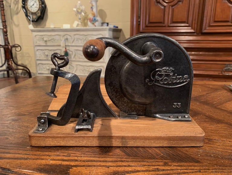 https://a.1stdibscdn.com/early-20th-century-german-iron-and-wood-adjustable-meat-and-bread-slicer-for-sale-picture-5/f_9512/f_182095411583870264994/192_108_5_master.jpg?width=768