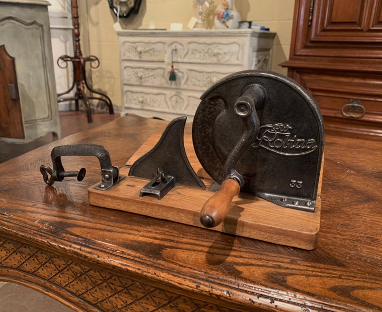 https://a.1stdibscdn.com/early-20th-century-german-iron-and-wood-adjustable-meat-and-bread-slicer-for-sale-picture-6/f_9512/f_182095411583870268076/192_108_6_master.jpg?width=768