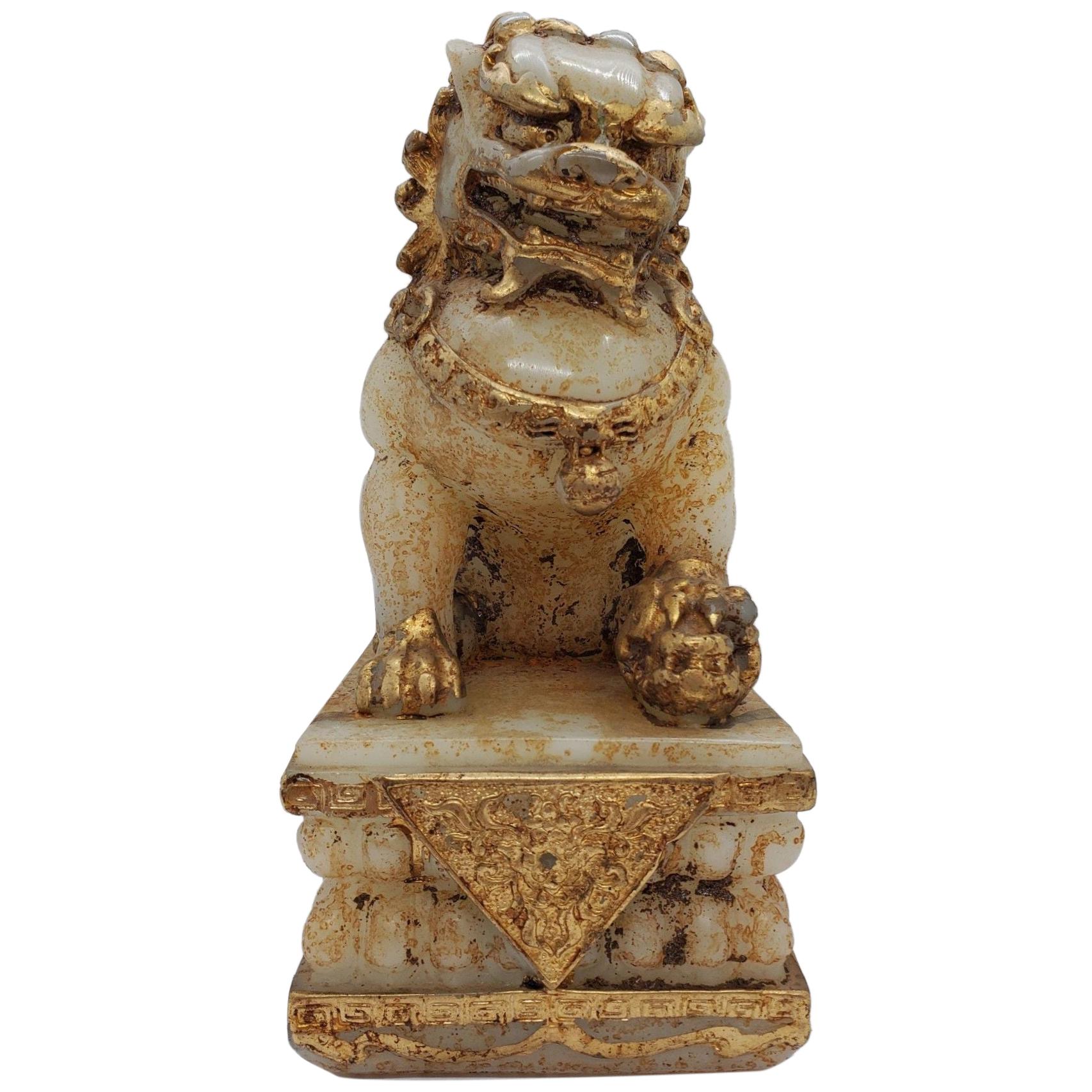 Early 20th Century Gilded Stone Foo Dog For Sale