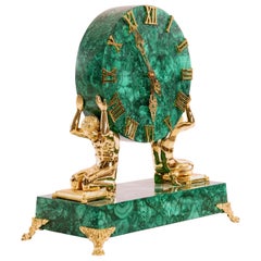 Pendule de cheminée en malachite en bronze doré et patiné du début du XXe siècle