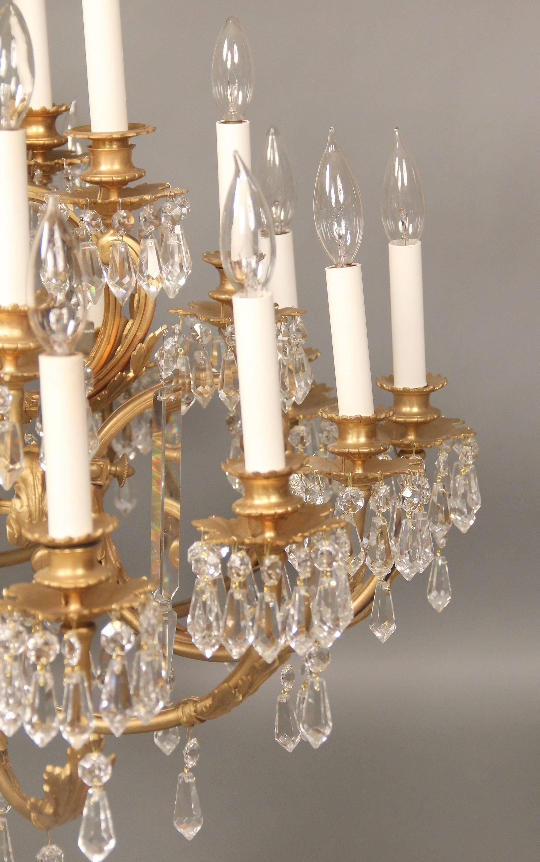 French Early 20th Century Gilt Bronze and Drop Crystal Twenty Five Light Chandelier For Sale