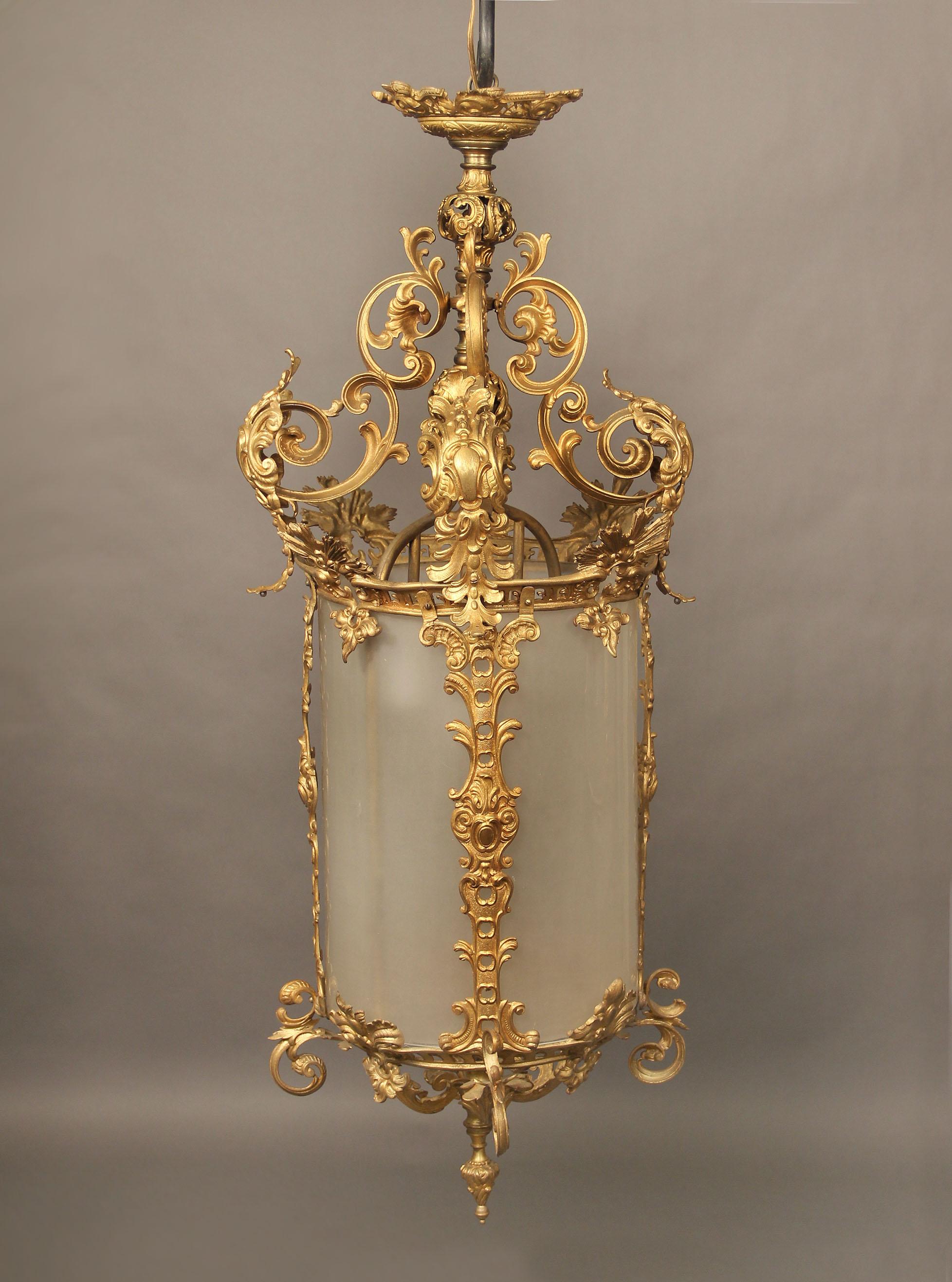 An early 20th century gilt bronze and glass lantern

with wonderful gilt bronze designs, three interior lights.