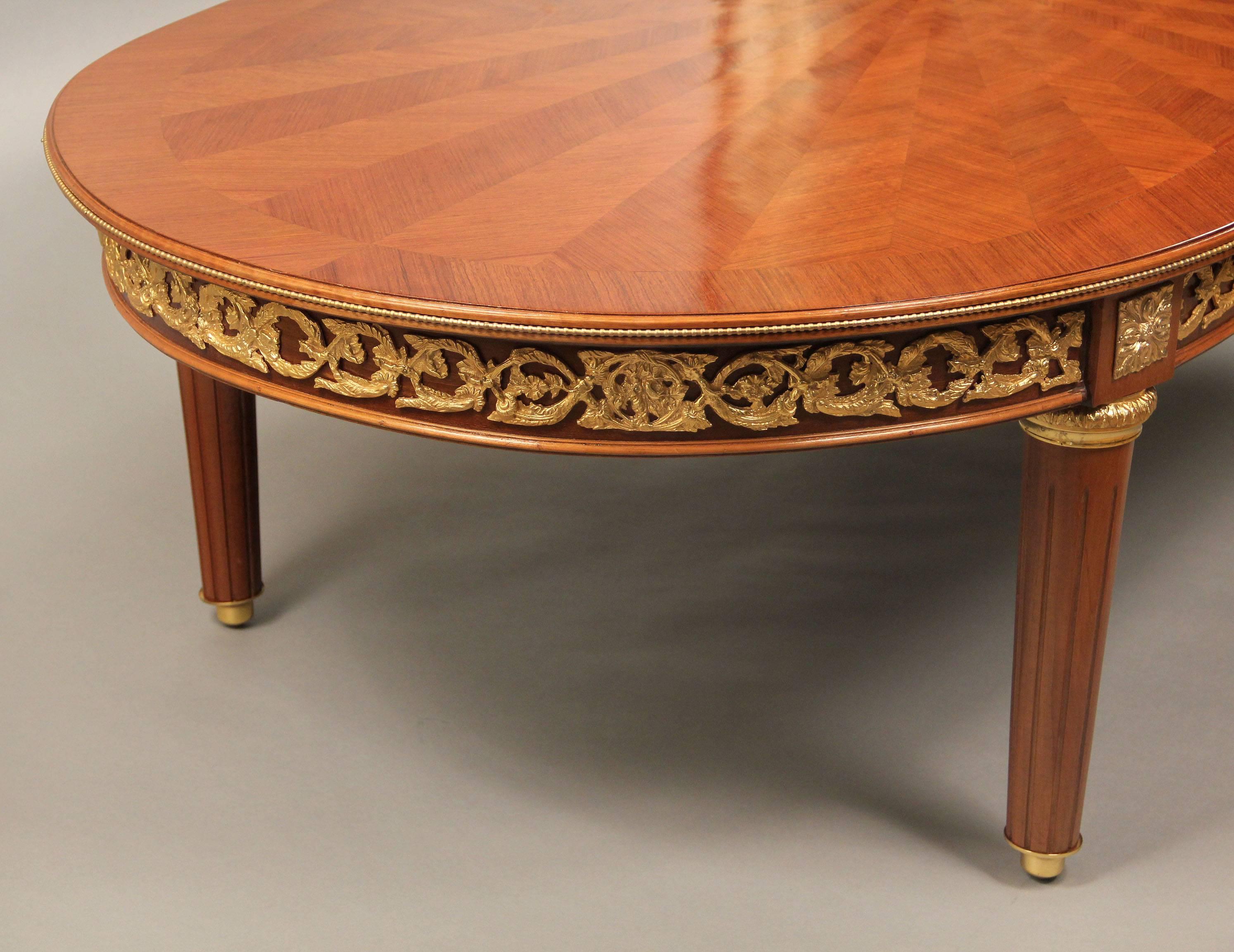 Early 20th century gilt bronze mounted Louis XVI style marquetry coffee table

Beautiful oval 