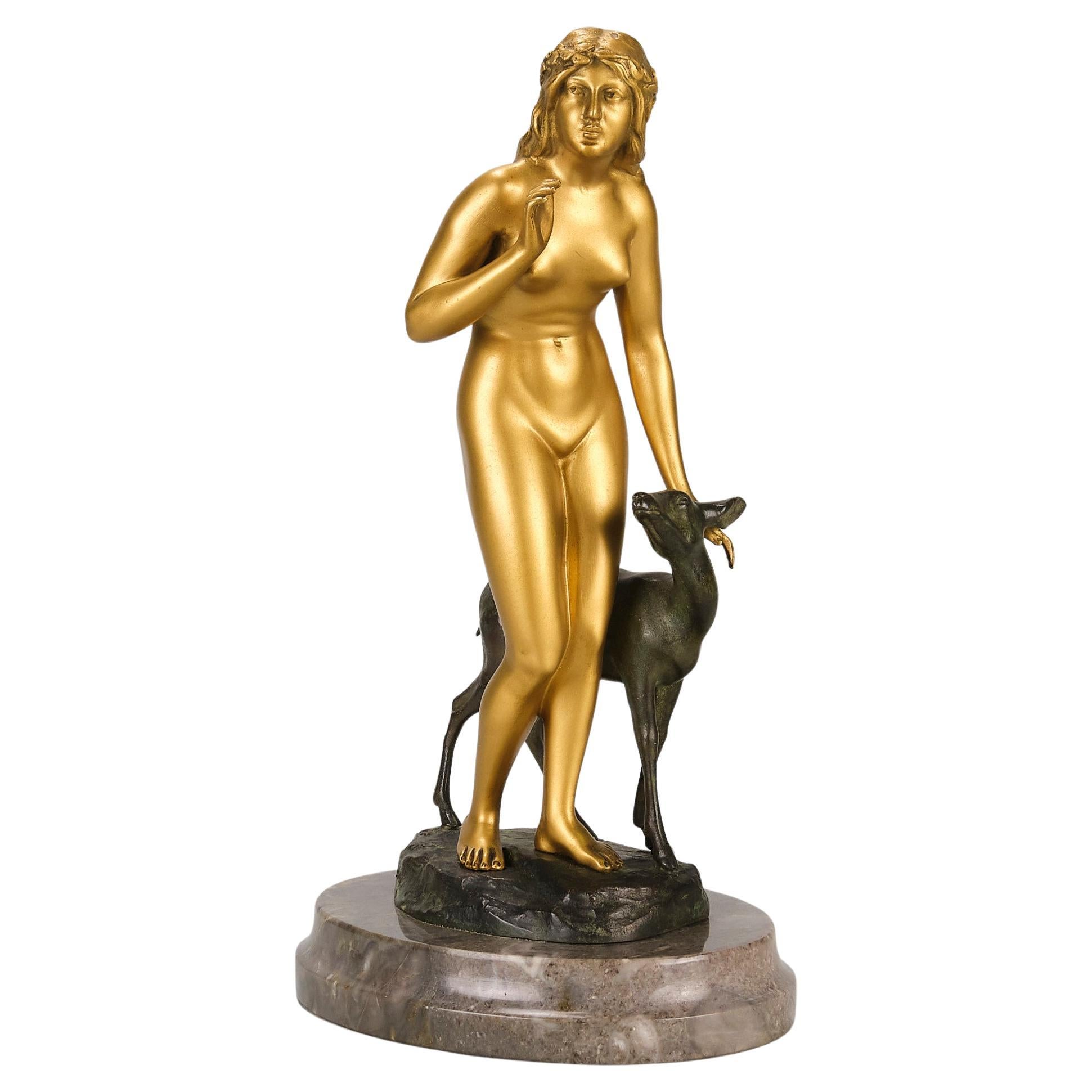 Studio in bronzo dorato dei primi del Novecento intitolato "Donna e cervo" di Perrot in vendita