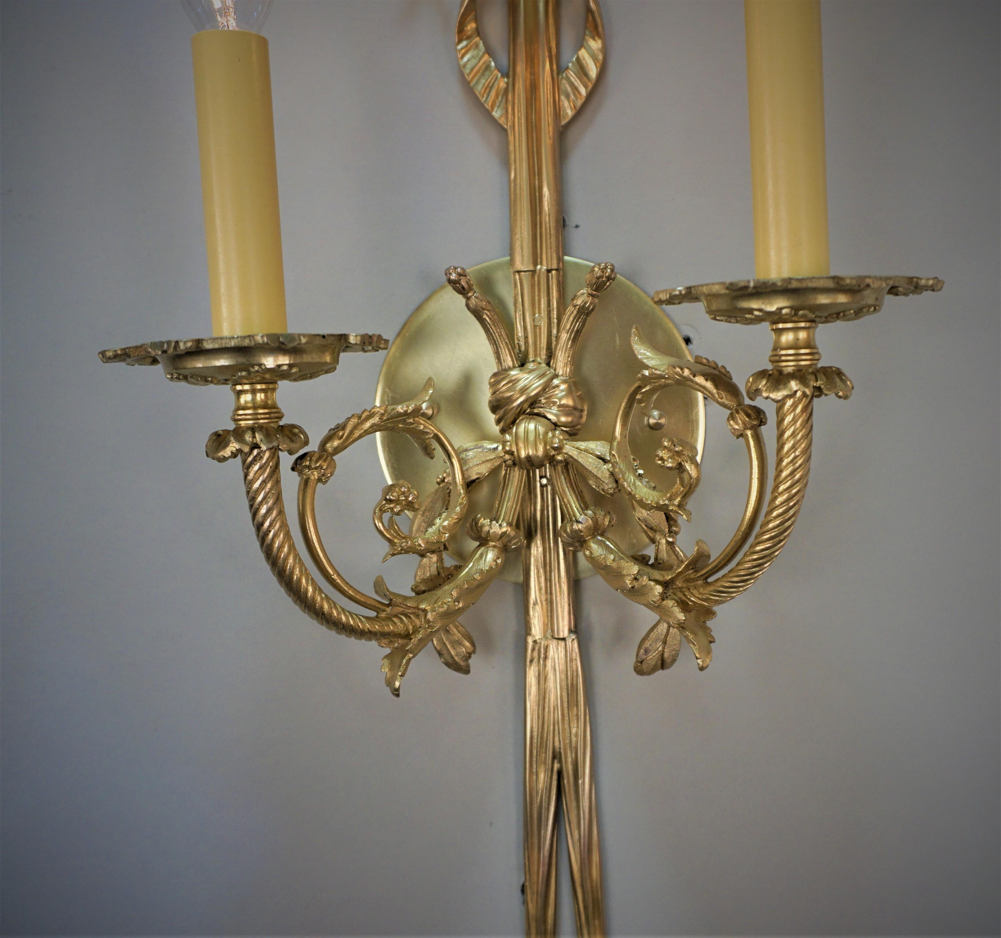 Early 20th Century gilt bronze double arm wall sconces.
Professionally rewired and ready for installation, 60watts max each.