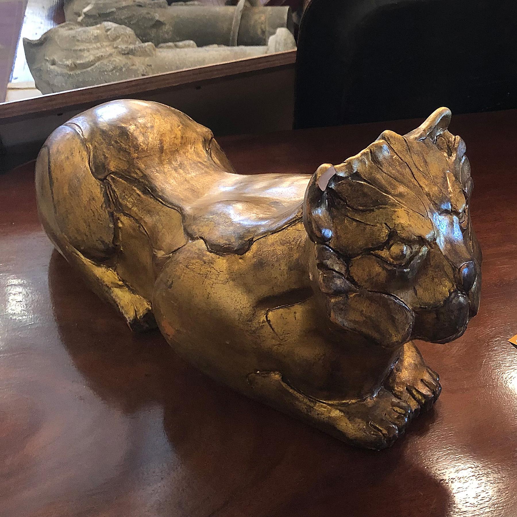 This pair of unusual gilt terracotta cats come from a Milan Fashion House.