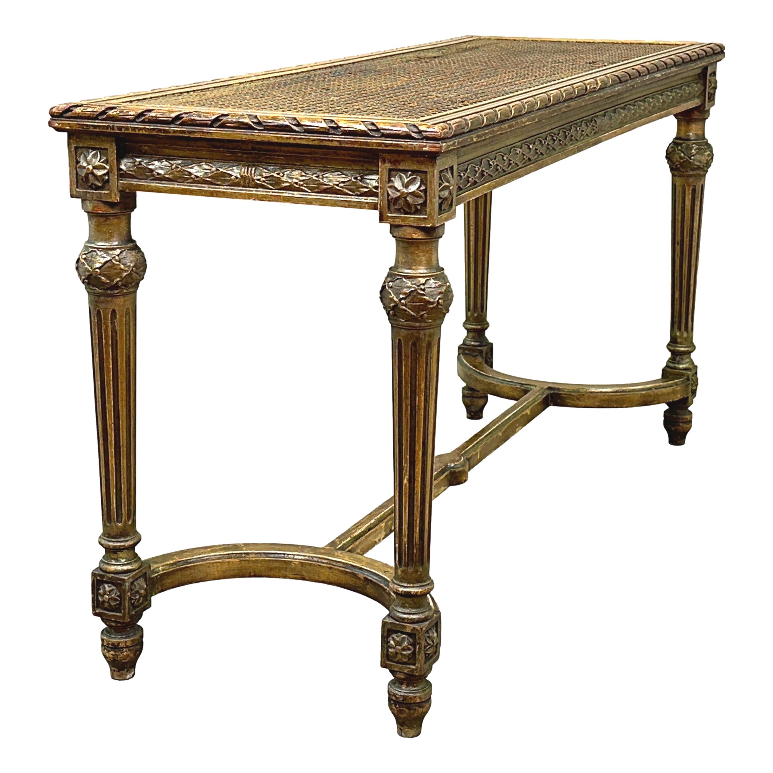 A Charming And Extremely Attractive Early 20th Century Giltwood Rectangular Luggage Rack, Or Stool, Having Original Caned Top, Or Seat, Over Well Carved Frame. Raised On Elegant Turned, Tapering, Fluted Legs United By Cross Stretcher.


Its