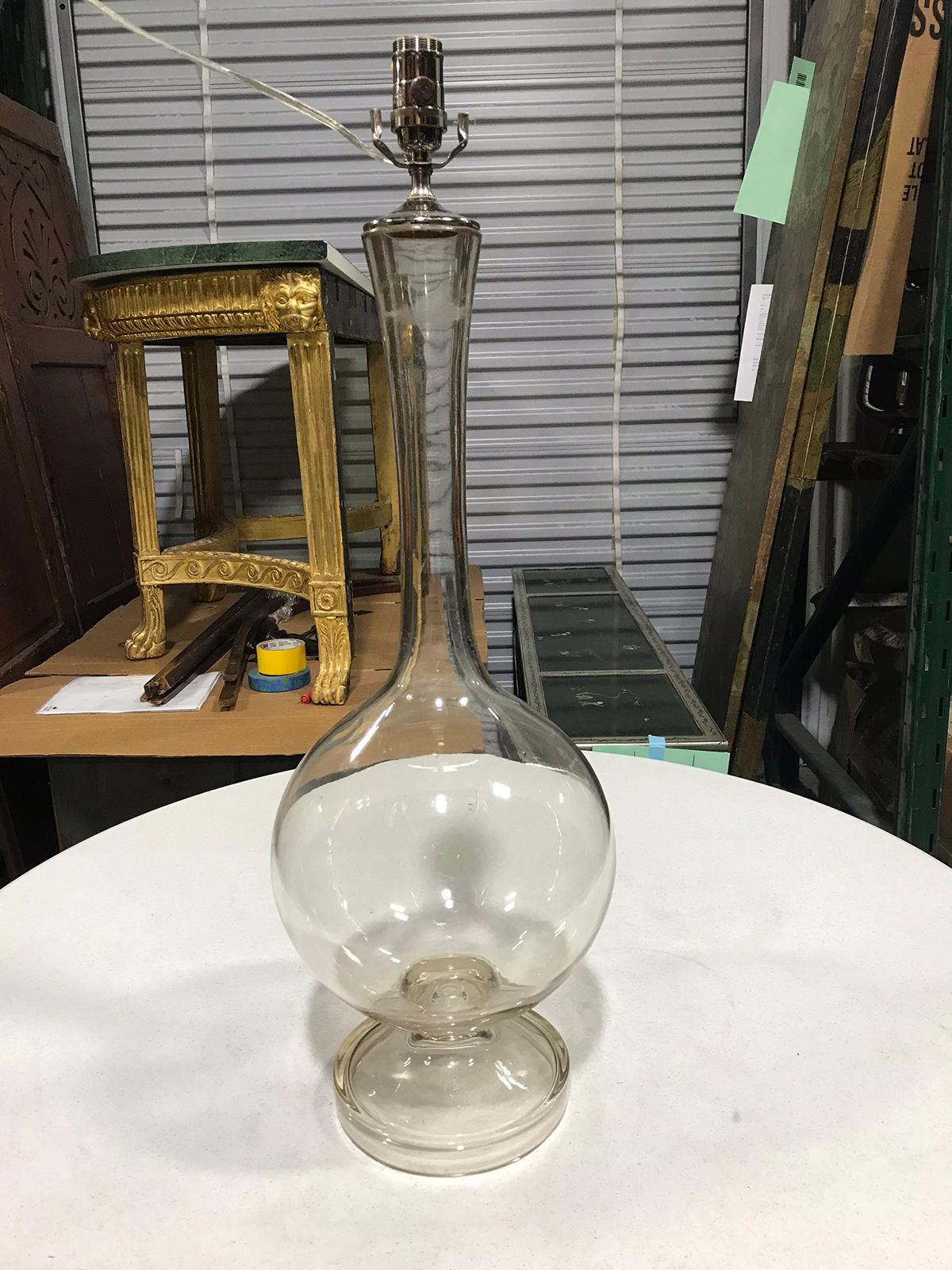 Early 20th century glass bottle as lamp
New wiring.