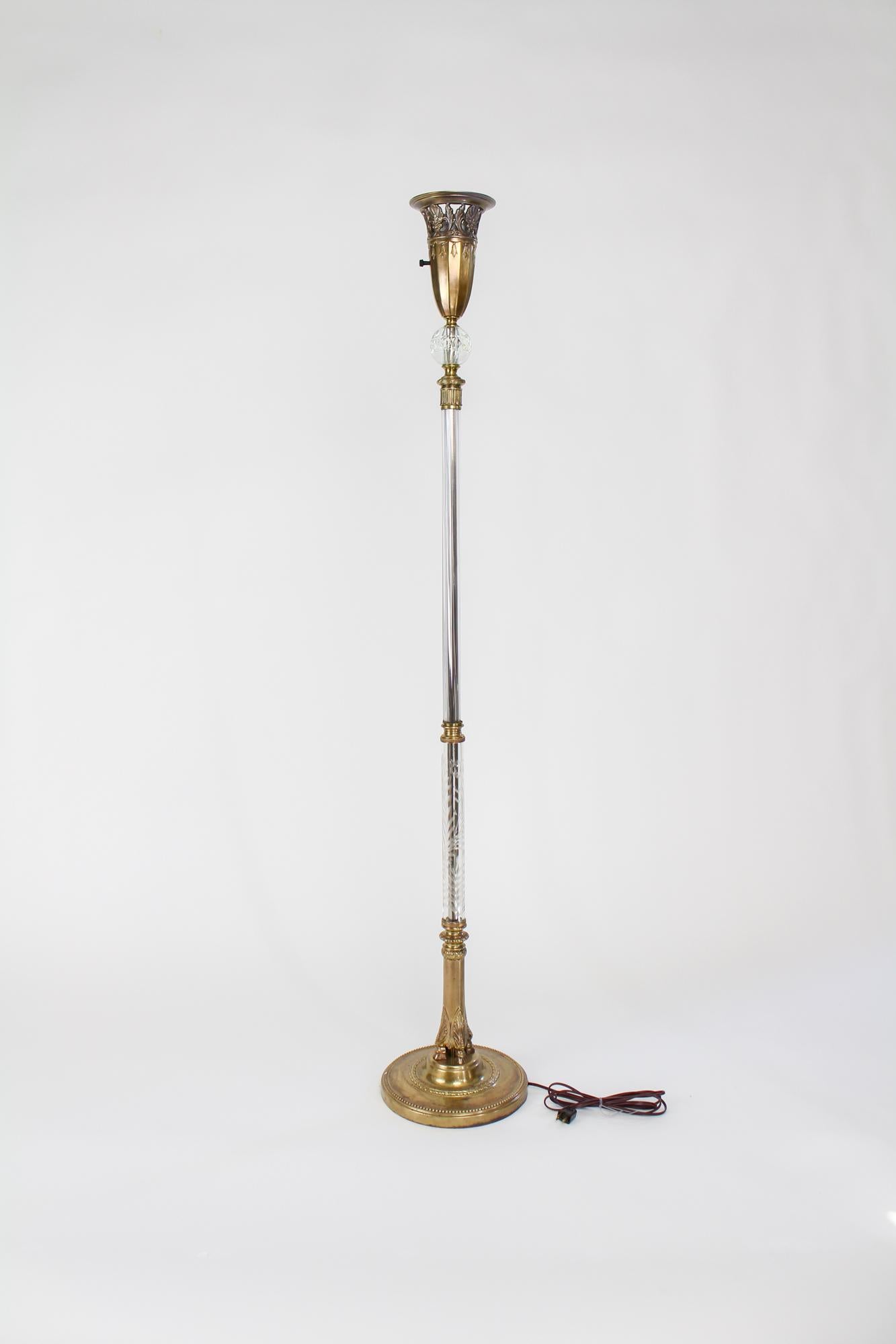 An American torchiere floor lamp from the 1930s. Original gold wash torchiere glass shade, shows some light wear as visible in photos, but no major chips or cracks. Glass tubing in excellent condition, with an etched botanical pattern winding up.