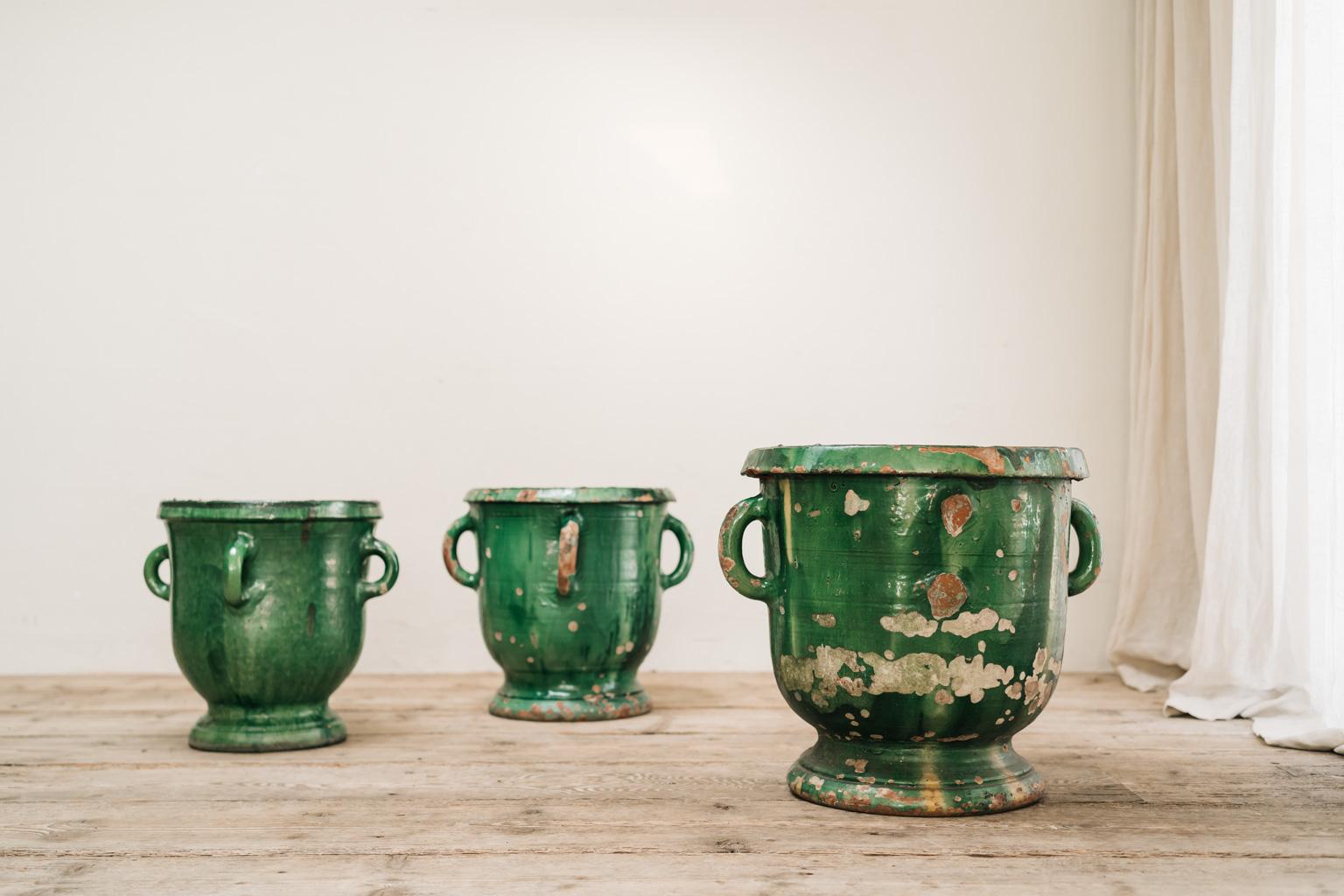 Early 20th century set of 3 glazed terra cotta jardinières/planters from Castelnaudary in France, dimensions 54 cm high x 61 cm diameter, 47 cm high x 55 cm diameter and 45 cm high x 50 cm diameter. Can be used indoors as well as outdoors .
 
