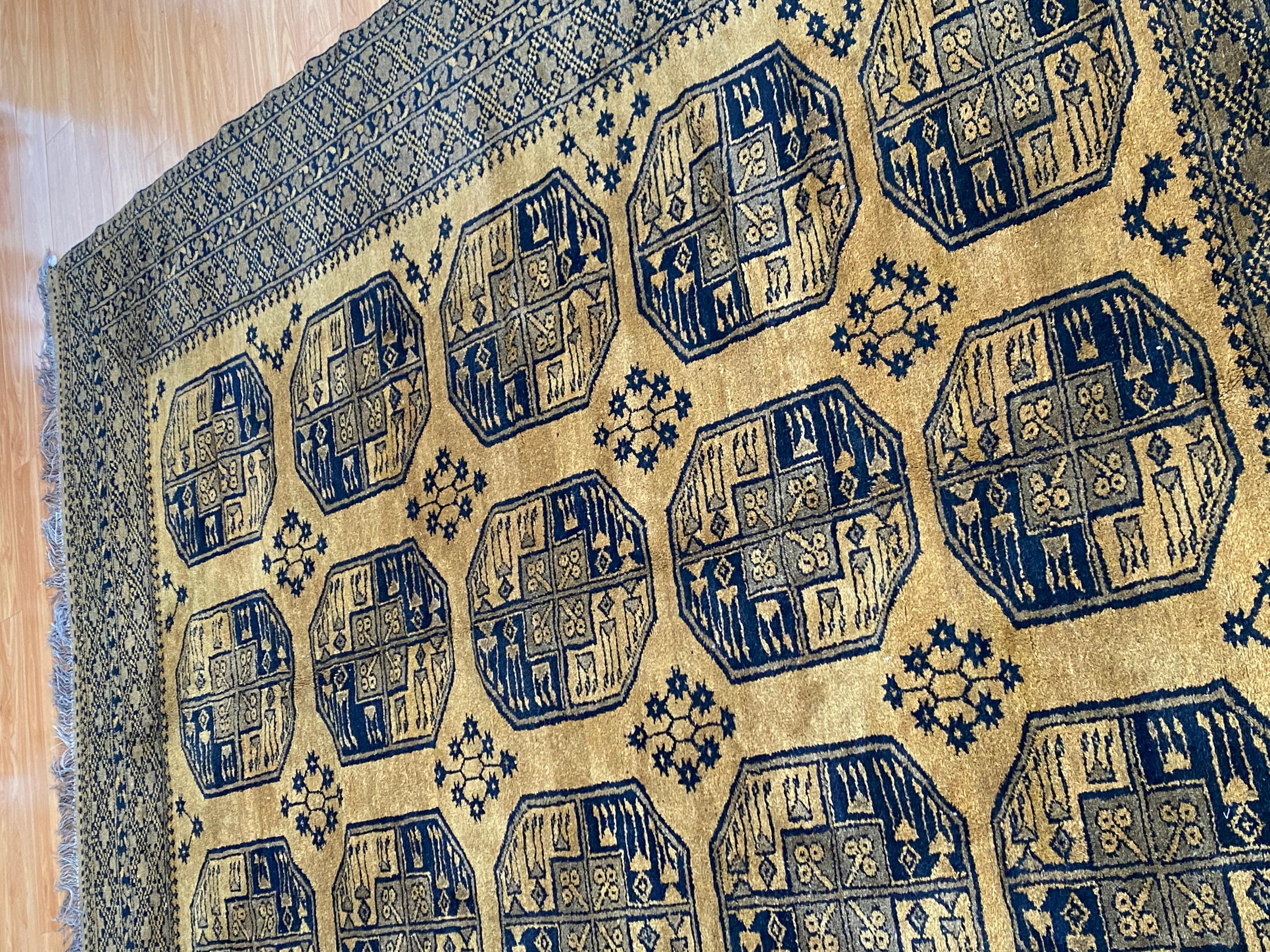 Hand-Crafted Early 20th Century Gold and Black Bokara Afghan Rug For Sale