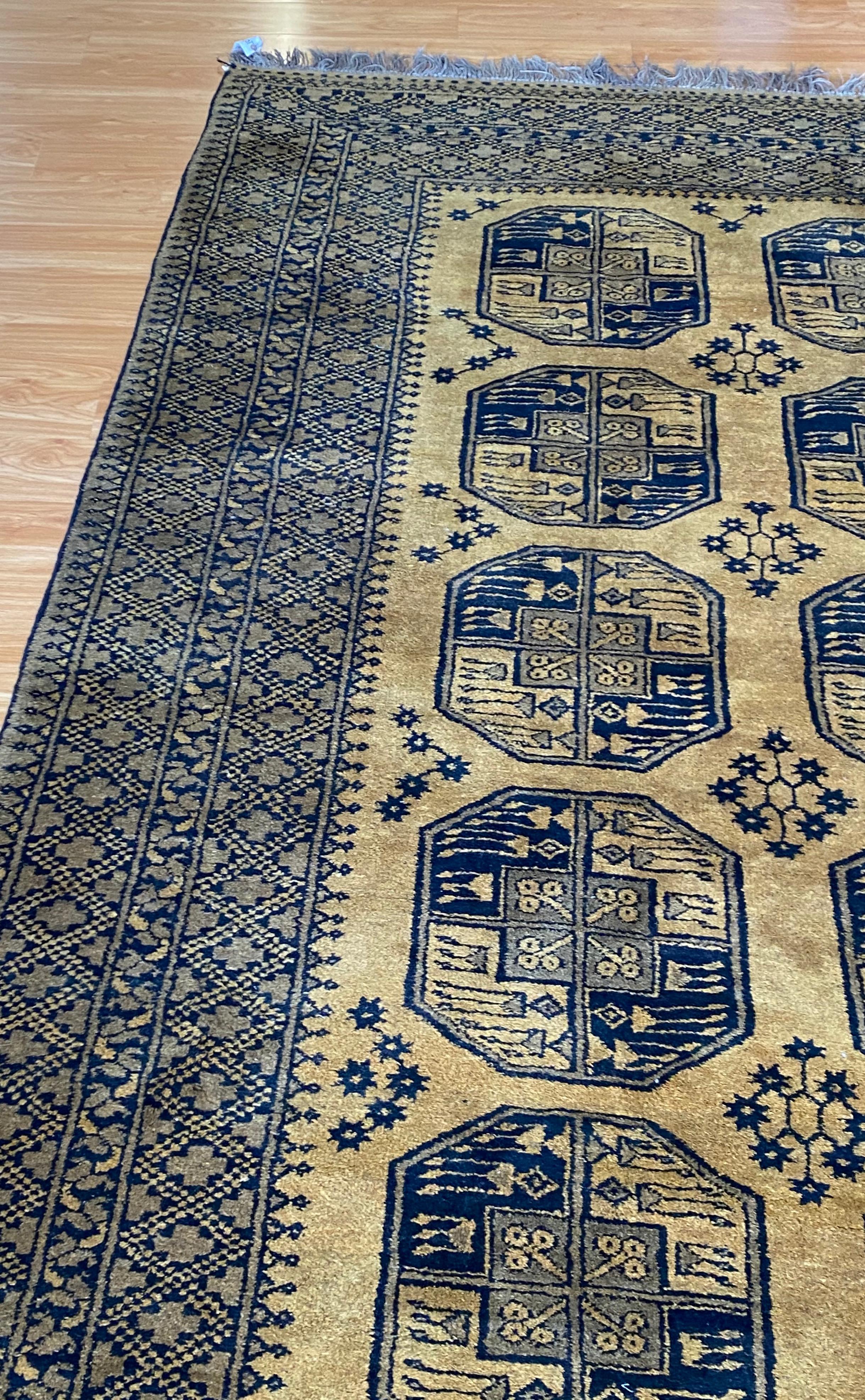 Early 20th Century Gold and Black Bokara Afghan Rug In Good Condition For Sale In San Francisco, CA