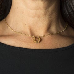 Early 20th Century Gold Chain with Horseshoe Pendant with Diamonds and Rubies