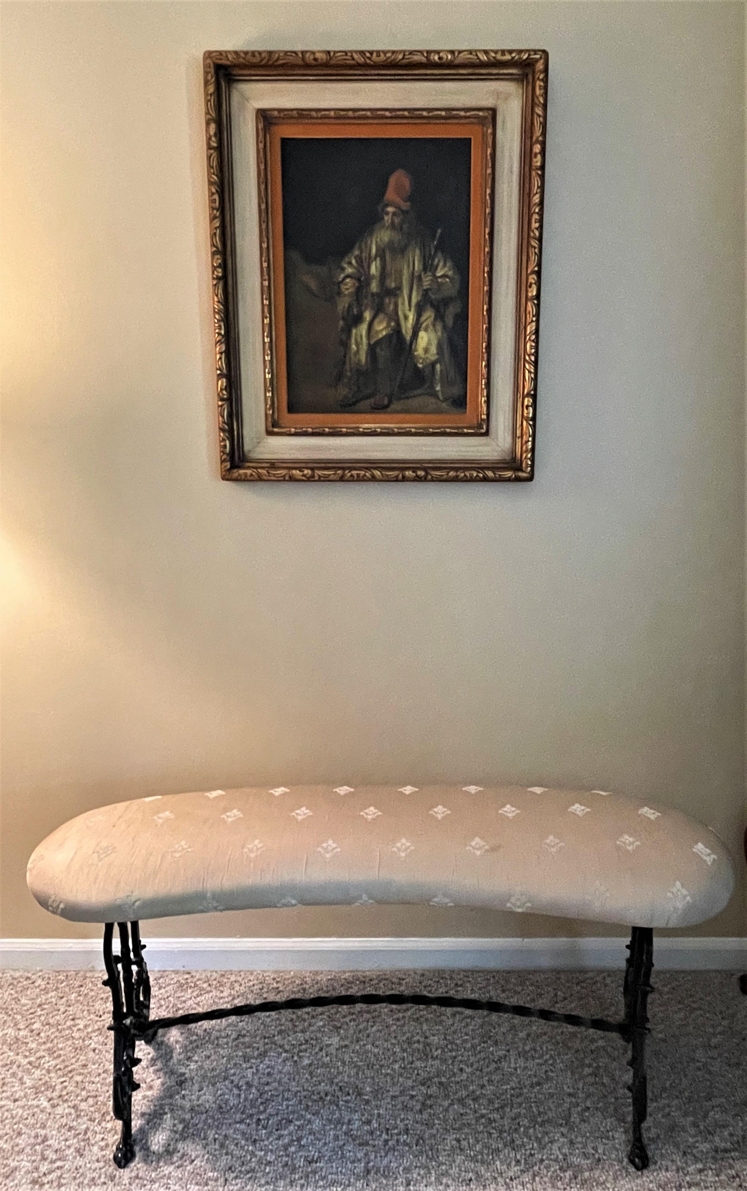A chic accent piece for any room, foyer or hall. From the Roaring 20s, this black cast iron bench is a well-crafted example of the Gothic Revival style. It was beautifully reupholstered in a champagne-colored silk fabric. The light-color fabric set