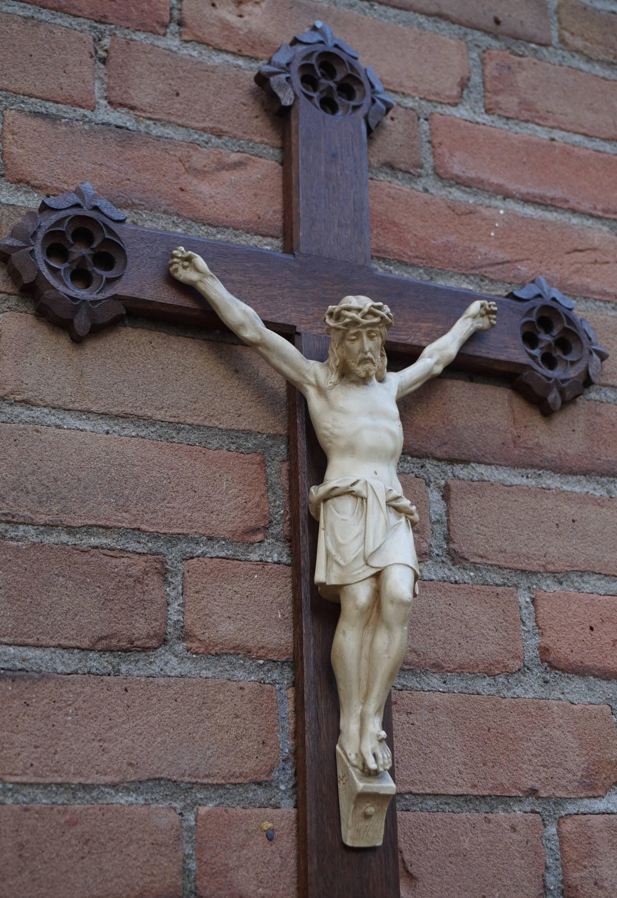 Gothic style oak crucifix with a white clay corpus of Christ.

What makes this rare crucifix extra stylish are the Gothic Revival elements that are hand-carved on the ends of each side. They make the look and feel of this antique religious artifact