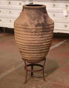 Early 20th Century Greek Fired Banded Terracotta Olive Jar with Iron Stand