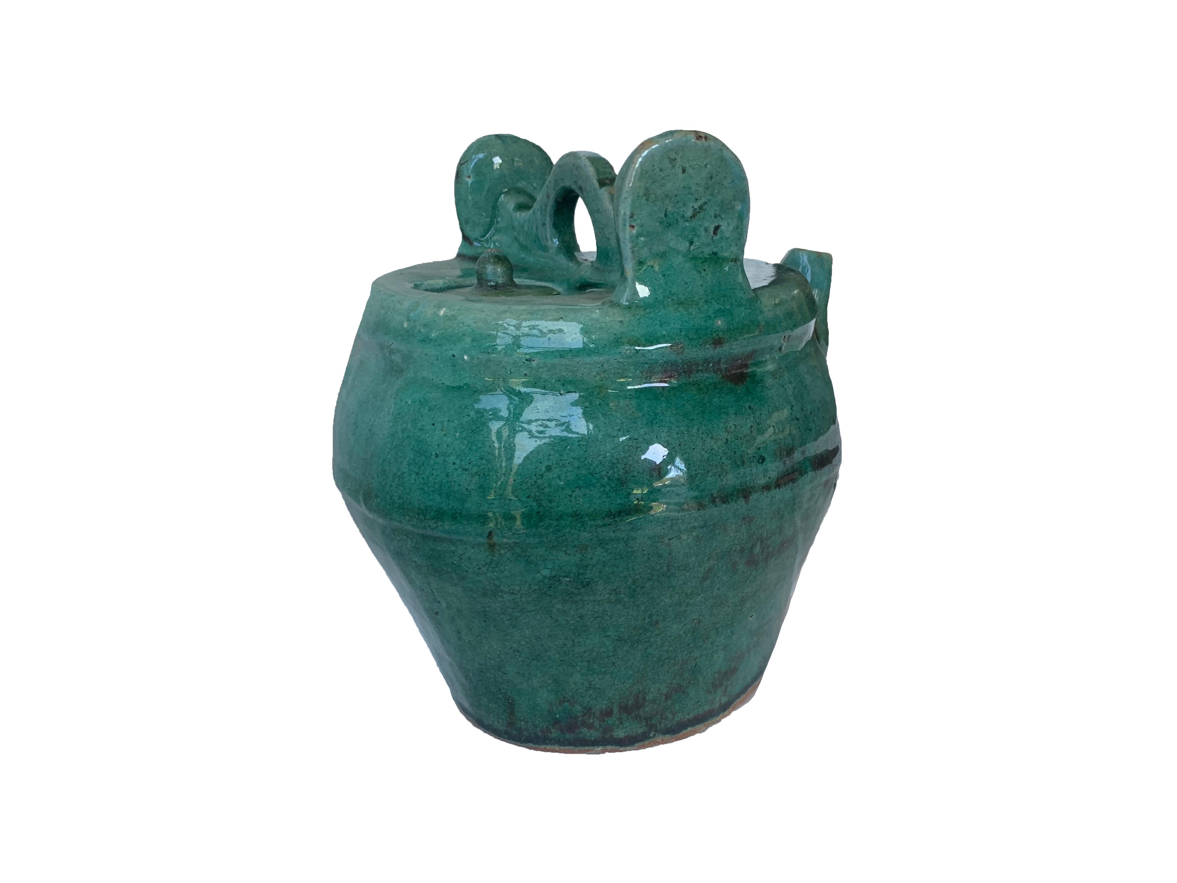 Early 20th century Shiwan green-glazed teapot from China's Shiwanzhen district near Guangdong.