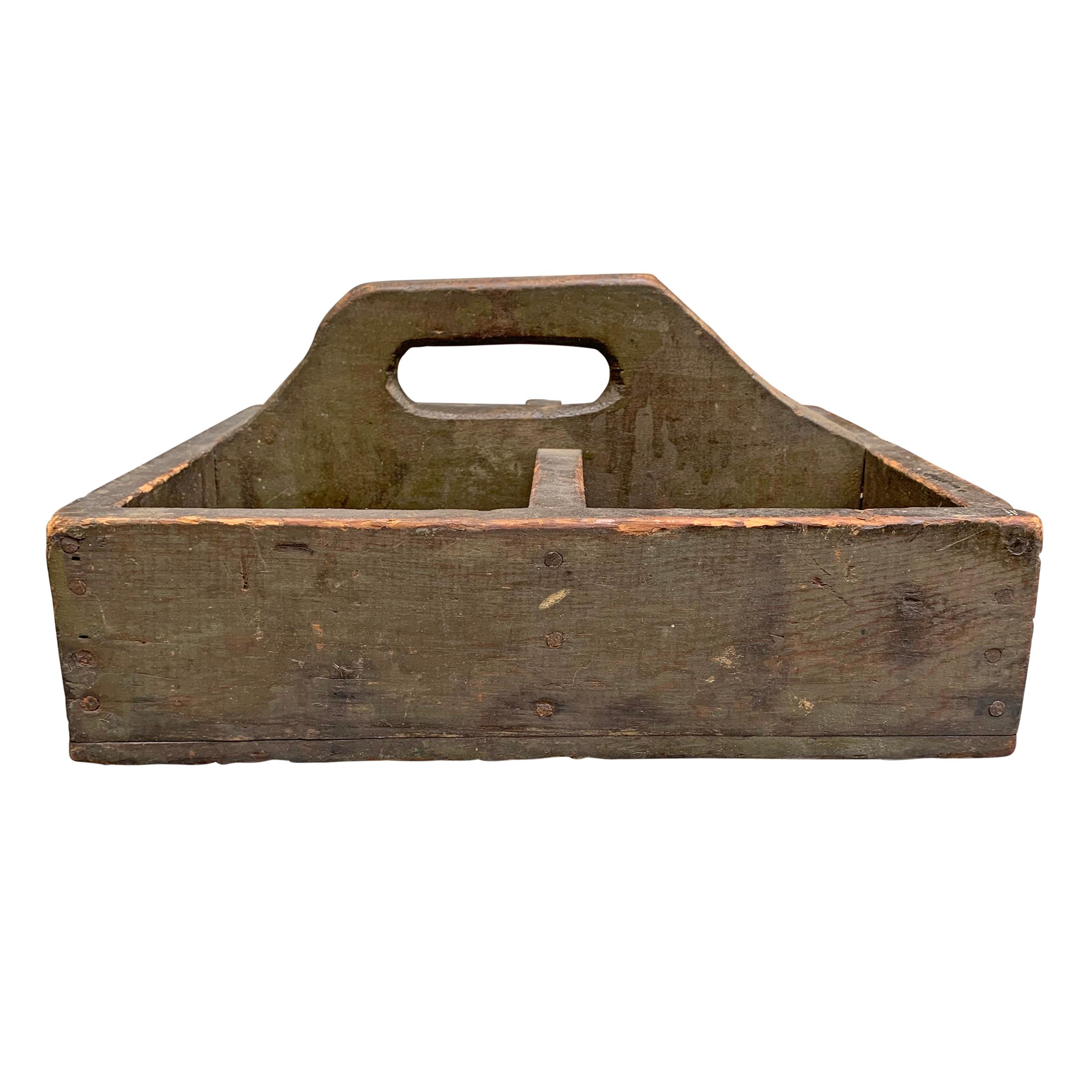 A charming early 20th century American tool box with a large handle on top, four divided sections, and retaining its original army green paint. Perfect in your kitchen filled with spices, or used as additional storage in your home office.