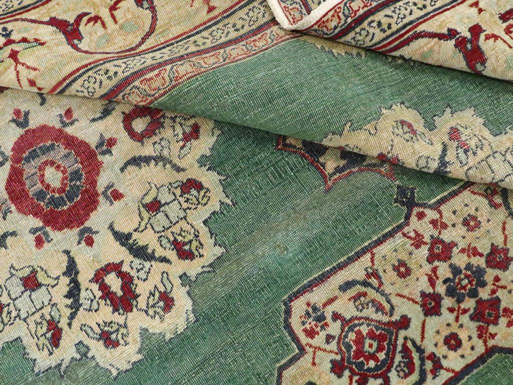 Early 20th Century Green, Red, and Beige Distressed Rug For Sale 2