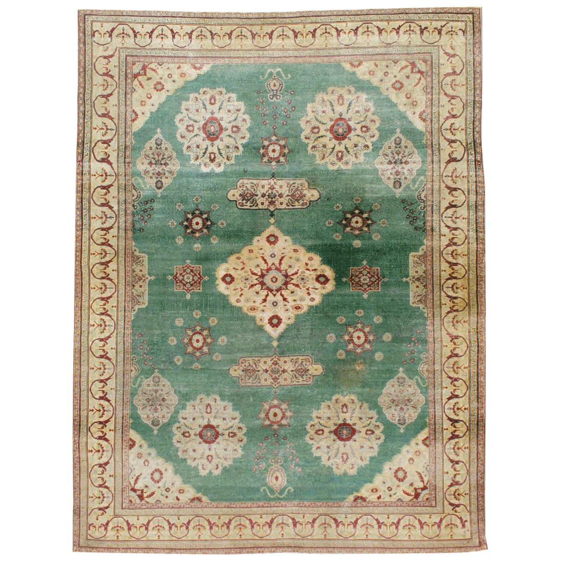 Early 20th Century Green, Red, and Beige Distressed Rug For Sale
