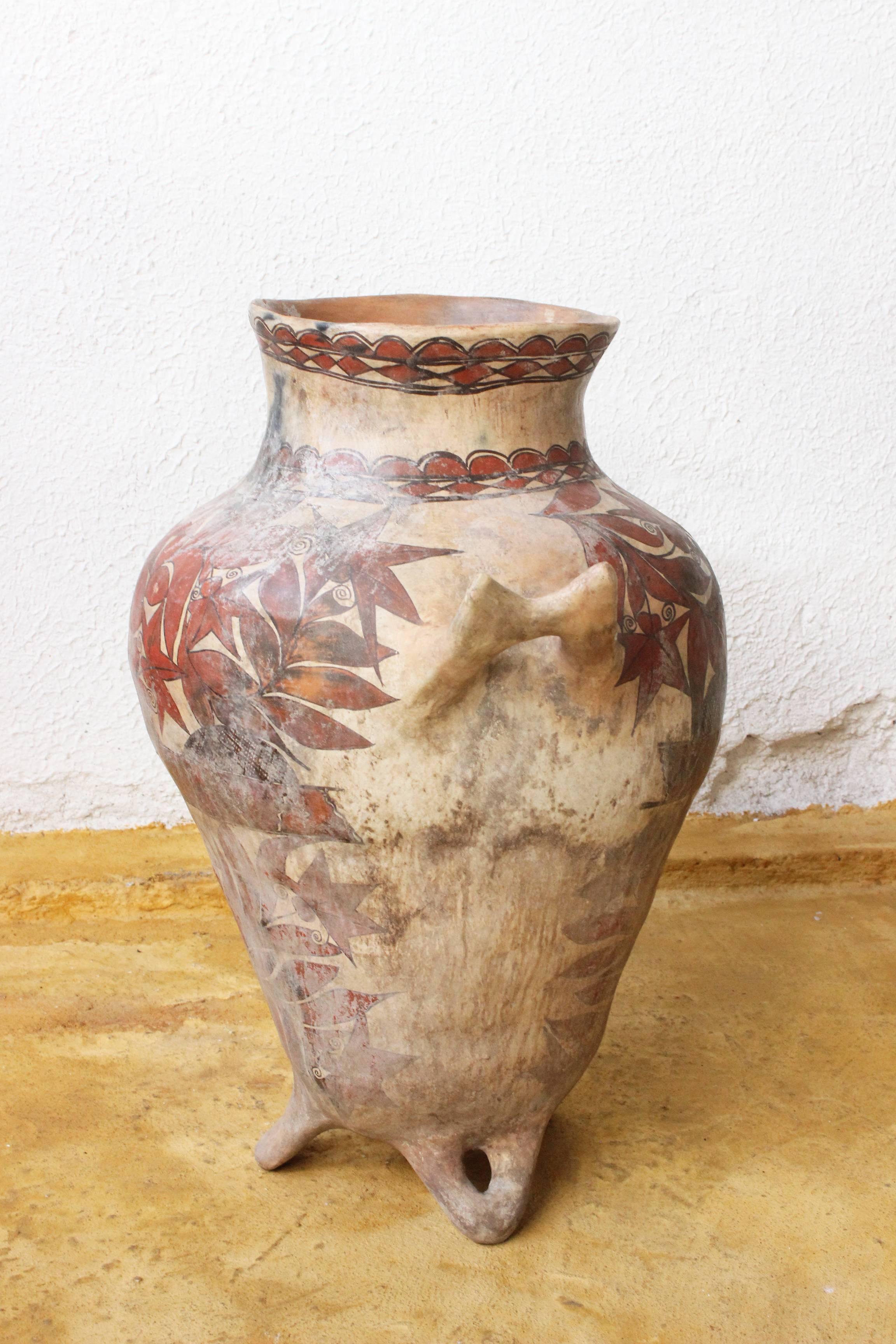 Here is a charming early 20th century ceramic water pot from the Rio Balsas region of Guerrero, Mexico. The pot is painted in the typical style now found on bark (amate) paintings all over Mexico. The bowl may have been made in Oapan or