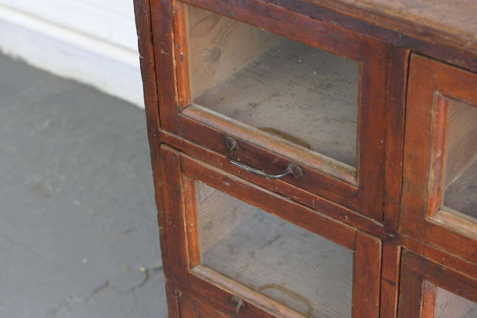 - Nine pull out windowed drawers
- Brass handles
- Pine drawers, top and sides
- French, circa 1900
- Measure: 120cm wide x 91cm tall x 70cm deep
- Each drawers measures 31cm wide x 21cm tall x 50cm deep

Condition report

All the drawers