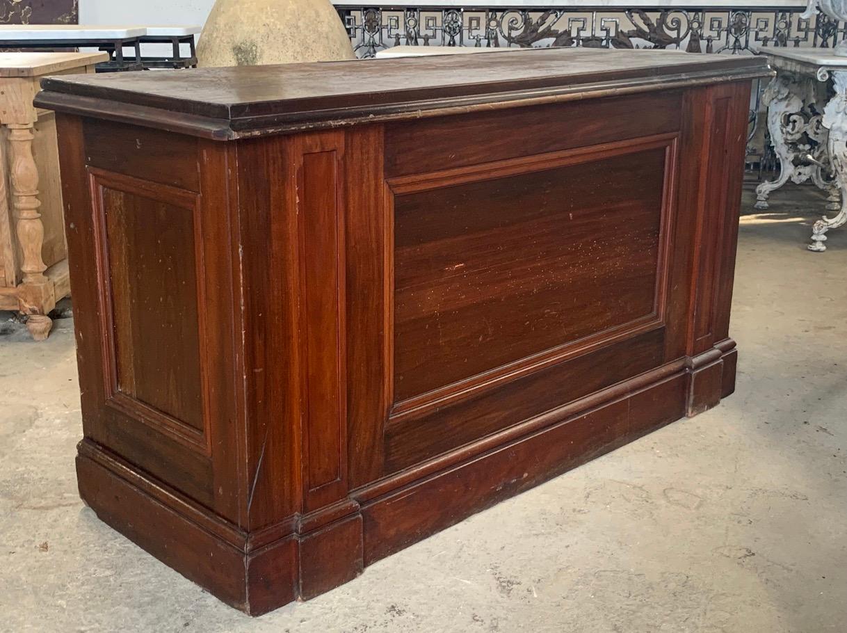 A nice early 20th century Haberdashery shop counter made from Mahogany and pine. The top still has the original brass yard rule for measuring cloth. Nice deep pine drawers for plenty of storage. The sides and back are panelled so this would make
