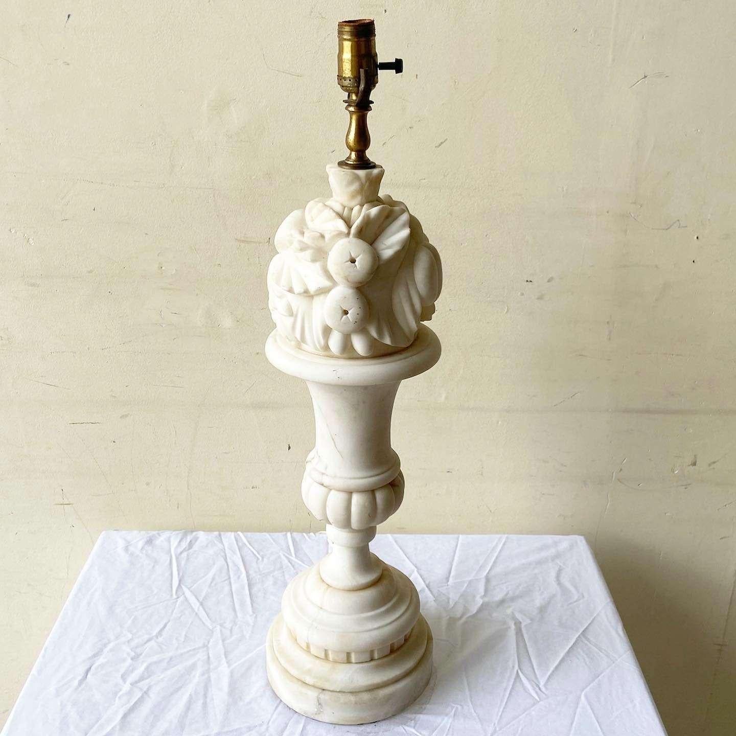 Exceptional early 20th century hand carved alabaster table lamp. Features a ornate sculpting of fruit around the top of the lamp.
