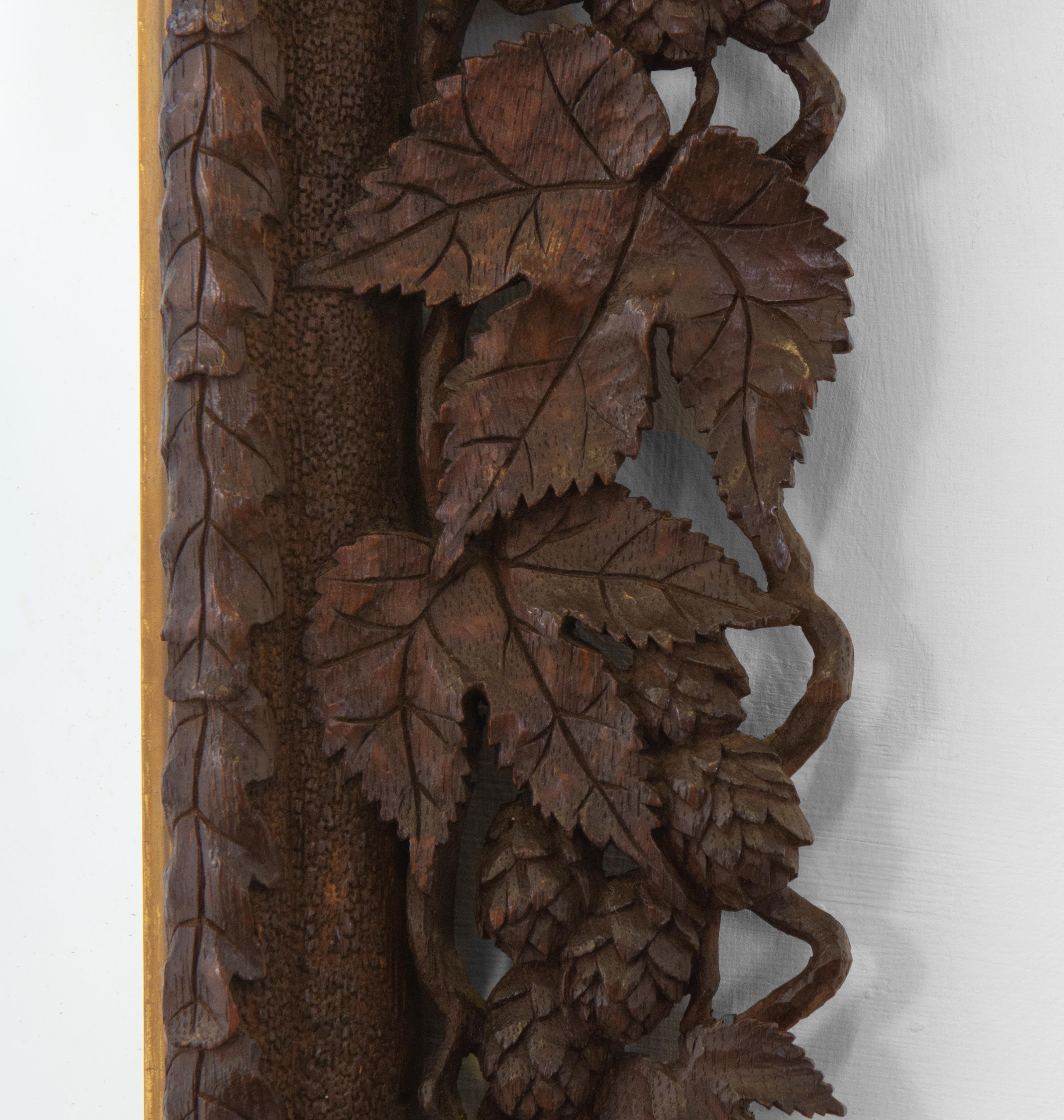 Hand-Crafted Early 20th Century Hand Carved And Giltwood Black Forest Oak Wall Mirror 