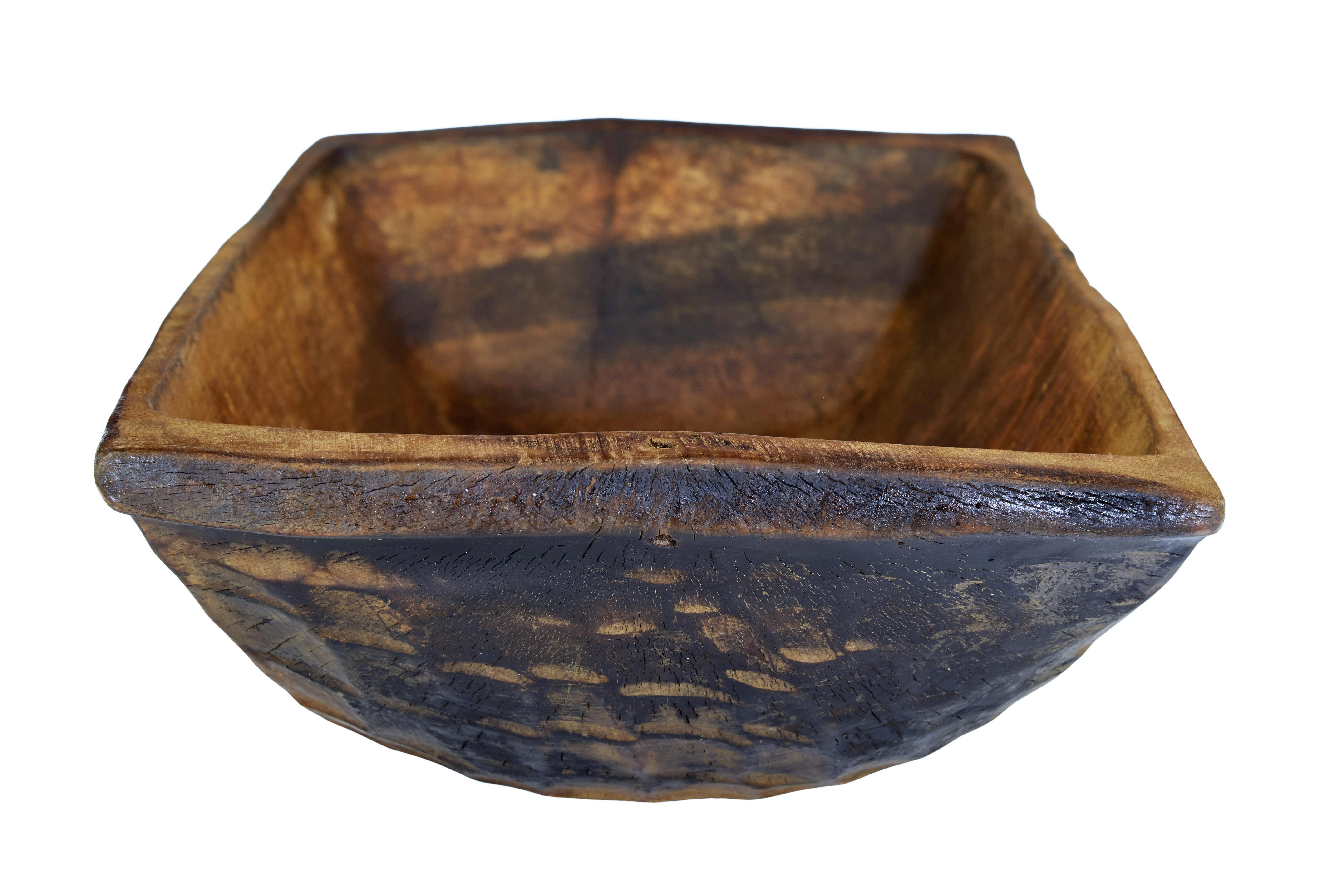 Early 20th century hand carved bowl circa 1900.

Functional piece of eastern european rustic woodenware.  Hand cut from a solid piece of wood and finished with an adzed technique.

Ideal for use as a table server or for retail display.  Charred to