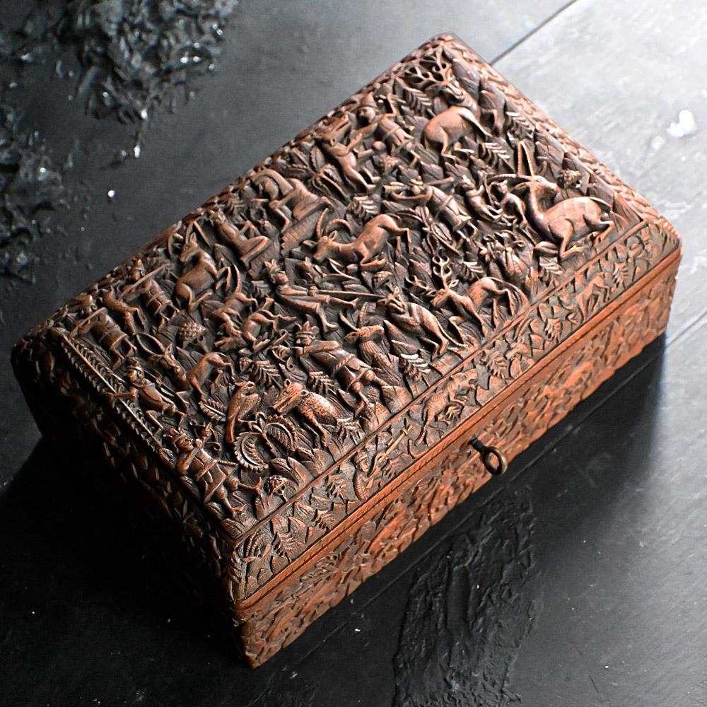 Early 20th century hand carved cigar casket.

We share what we love, and we love the amount of detail that has gone into creating this amazing cigar box. Covered in some wonderfully intricate carved scenes. Including animals such as wild birds,
