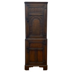 Early 20th Century Hand Carved English Oak Corner Cabinet