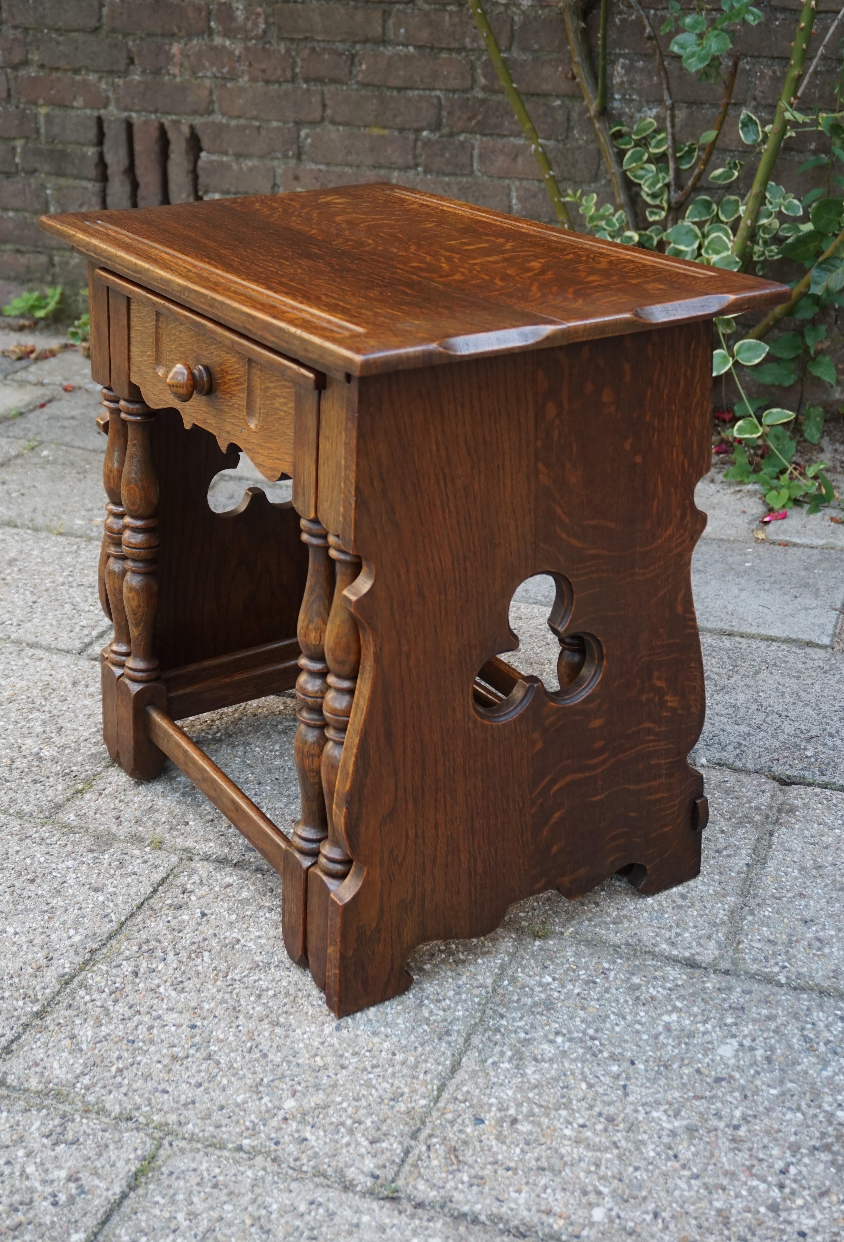 Rare set of Gothic Revival nesting tables.

This finest quality set of tiger oak stacking tables from the 1930s could not be in better condition. Perfectly sliding into and out of each other these striking tables with their warm patina are easy to