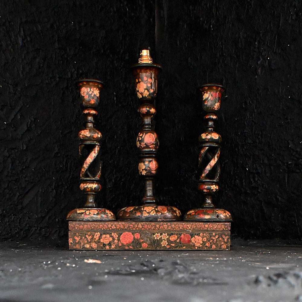 Early 20th Century Hand Crafted Kashmiri Candle Sticks and Box   
A collection of early 20th century hand crafted Kashmiri candle sticks, lamp, and glove box. All similar hand painted design, age and numbered bases. One of the candle sticks has been