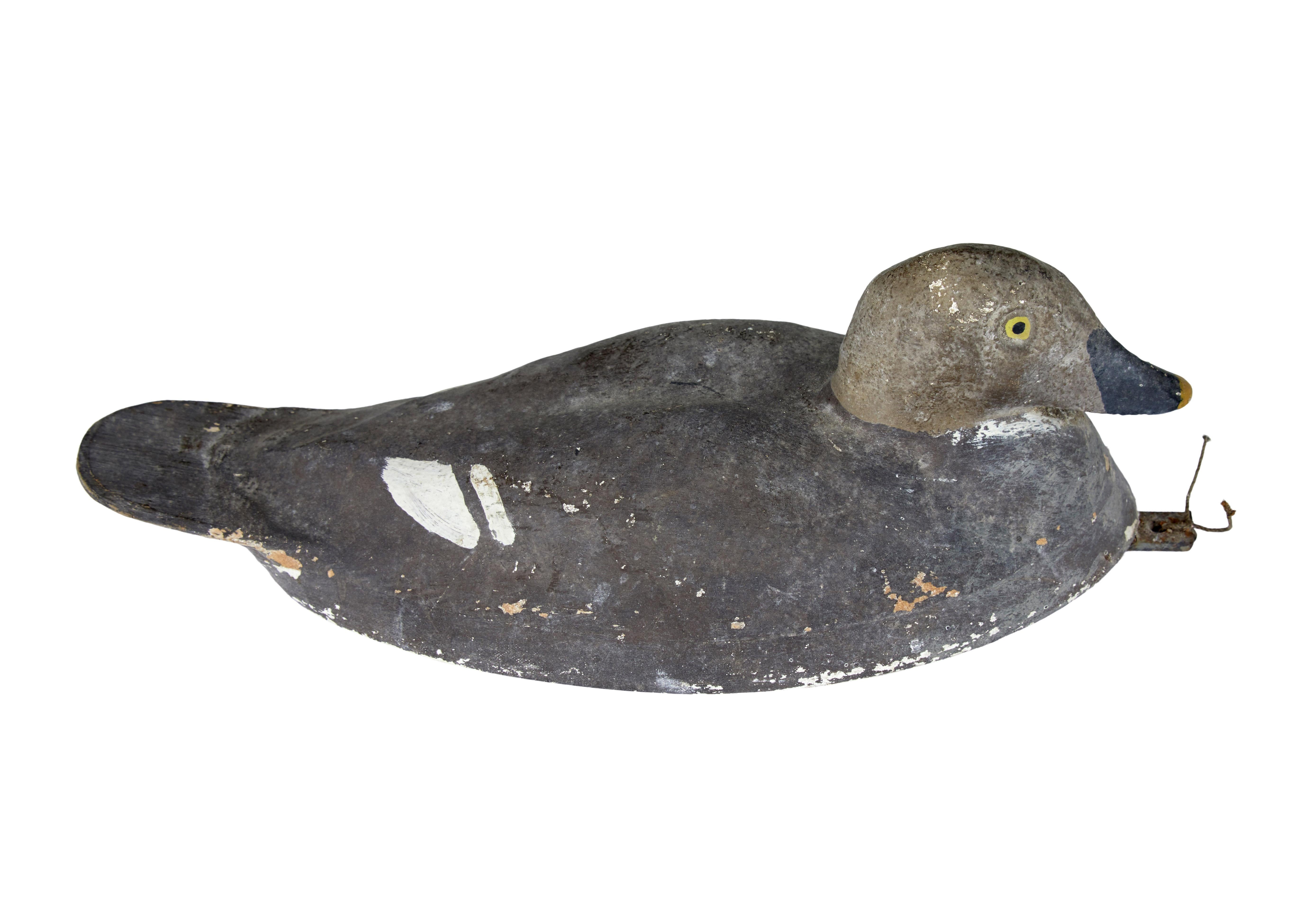 Early 20th century hand painted decoy duck circa 1920.

Hand made with Swedish label ideal vetter on the underside. Hand painted in dapple greys with white feathers and black beak.

Expected surface marks and losses to paint work.