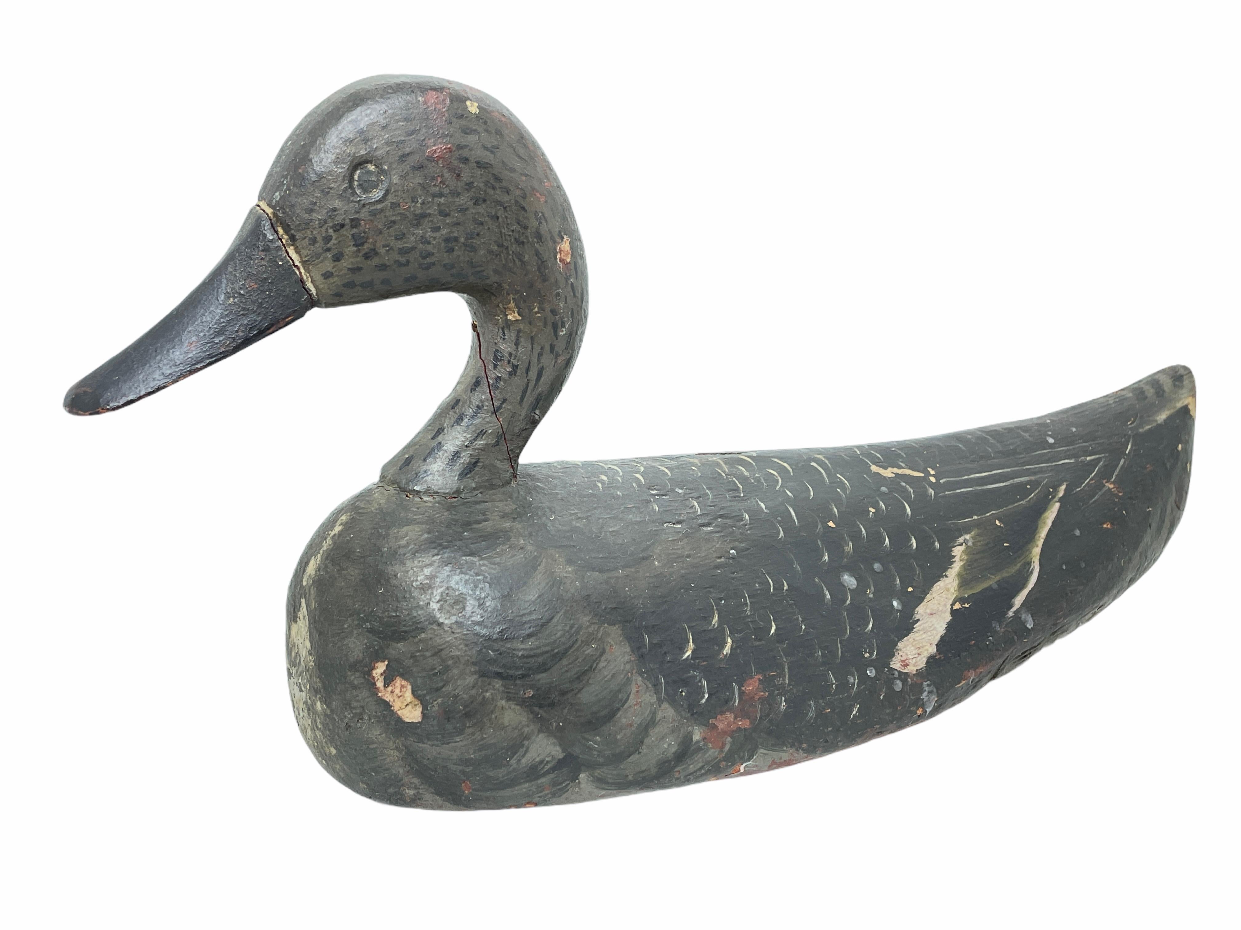 Found in Germany at an estate sale, this hand carved and hand painted duck decoy is perfect for the collector. Well used by a previous hunter the paint has faded through time although the original detail can be seen and admired. Nice Folk Art