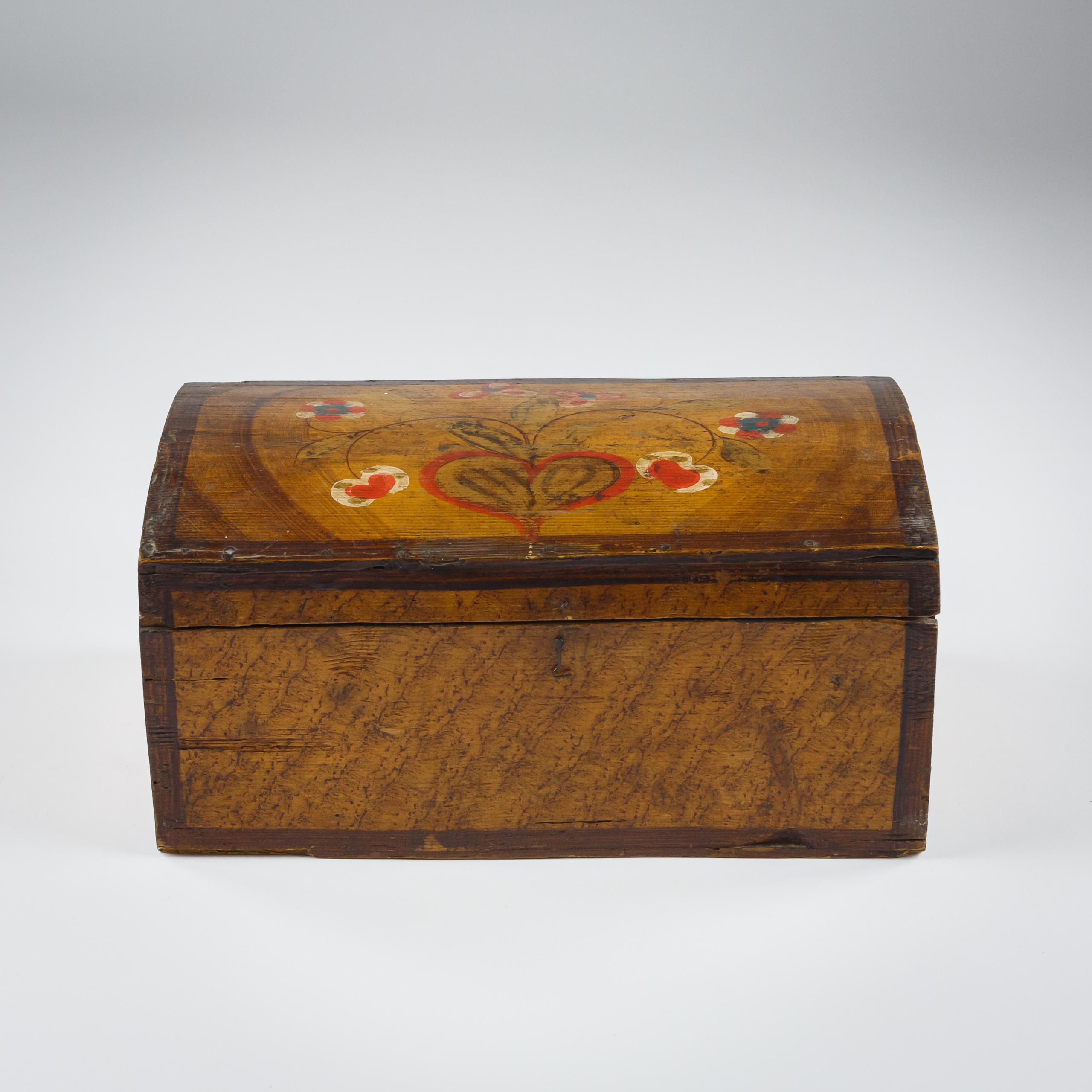 Faux Grain Painted Pine Marriage Trunk, with joyous simple Patriotic colour flowers and a bold heart to the top and t0 each end of the trunk. France. Circa, 1900