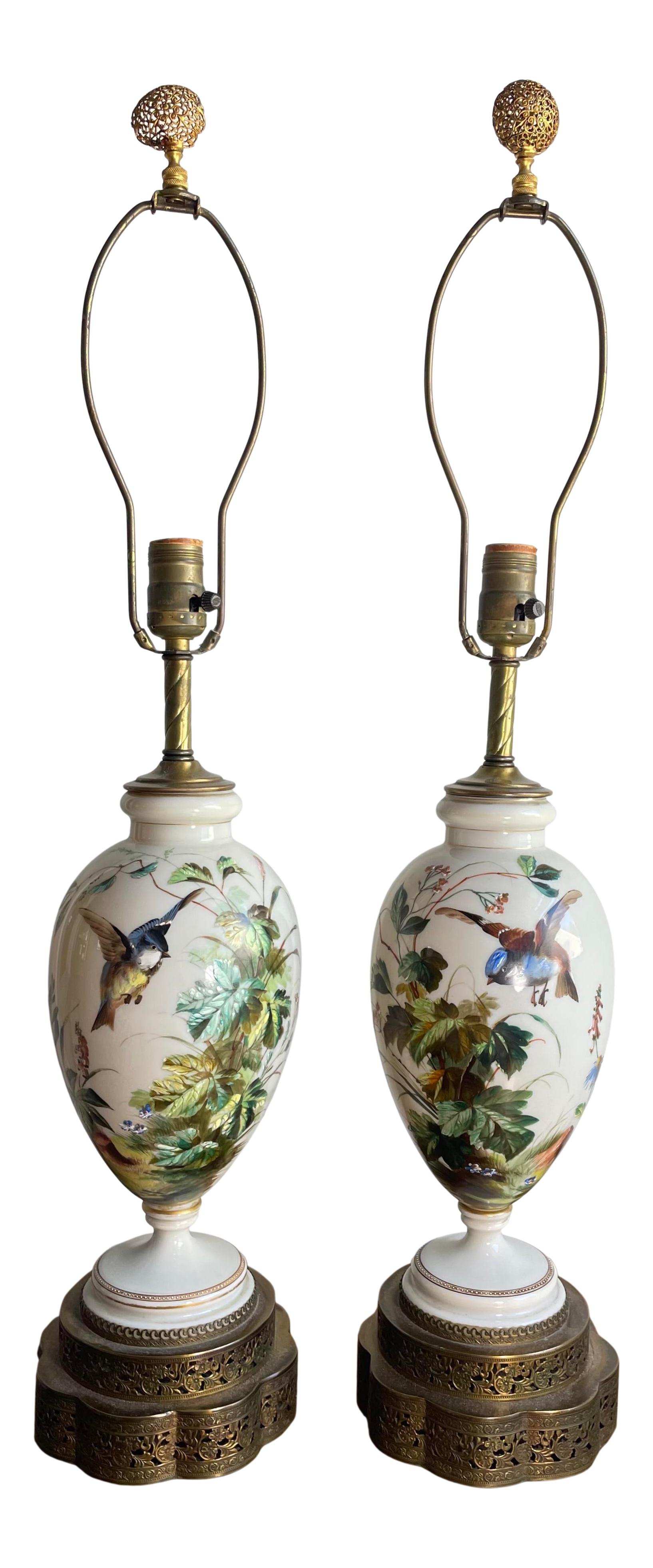 Beautiful 1930s / 40s hand painted ceramic lamps. Capturing the beauty of blue birds and nature. Ceramic lamps sit atop brass filagree base.

Measure: 18