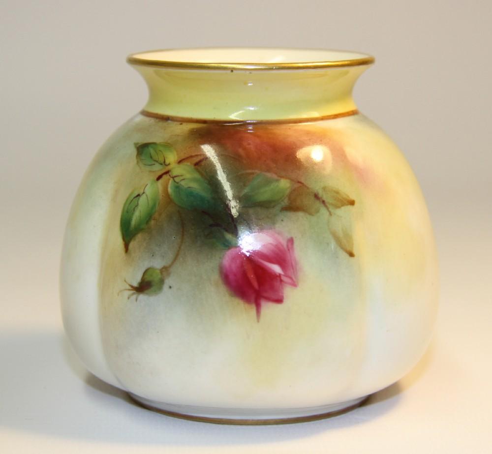 This lovely Royal Worcester Vase is decorated with hand painted roses in rich colors with a gilt rim. Date 1907.