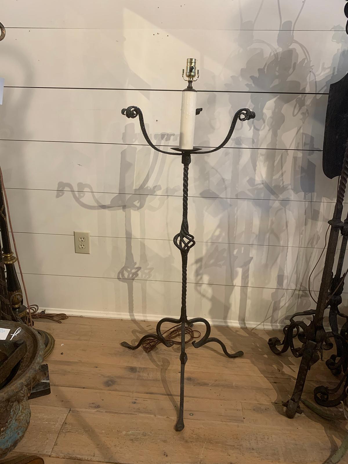 Early 20th century hand wrought iron torchère as floor lamp
Measures: 24
